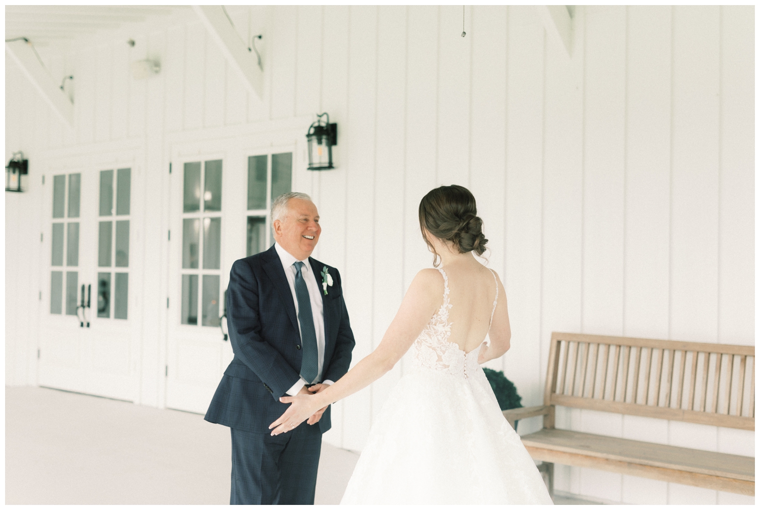 father of bride sees his daughter in wedding dress