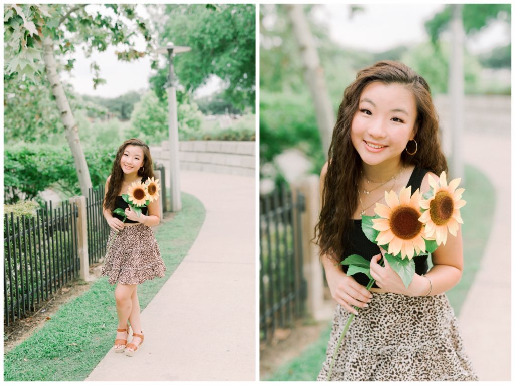 Houston high school senior holding flowers on sidewalk