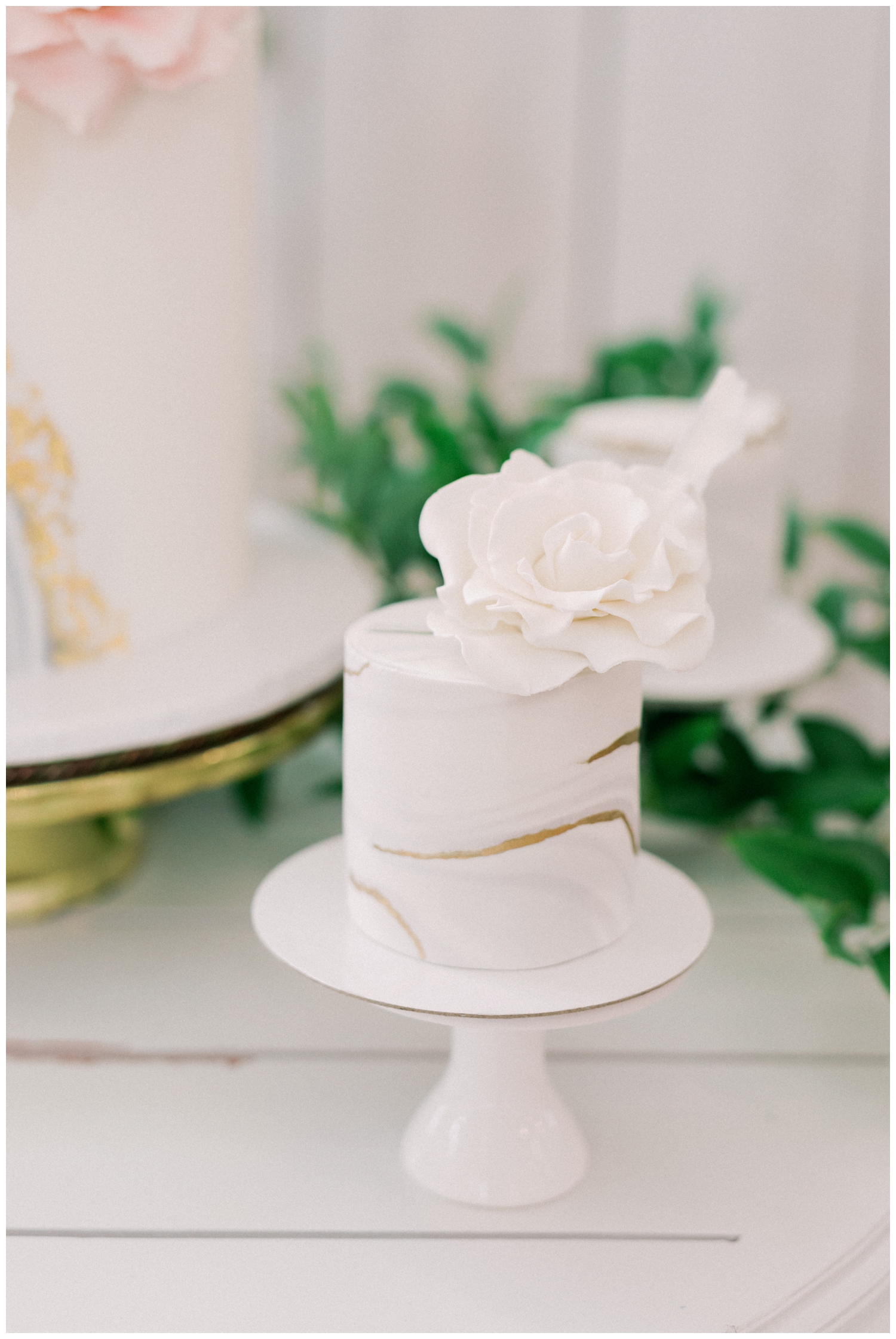 a white barn wedding cake display