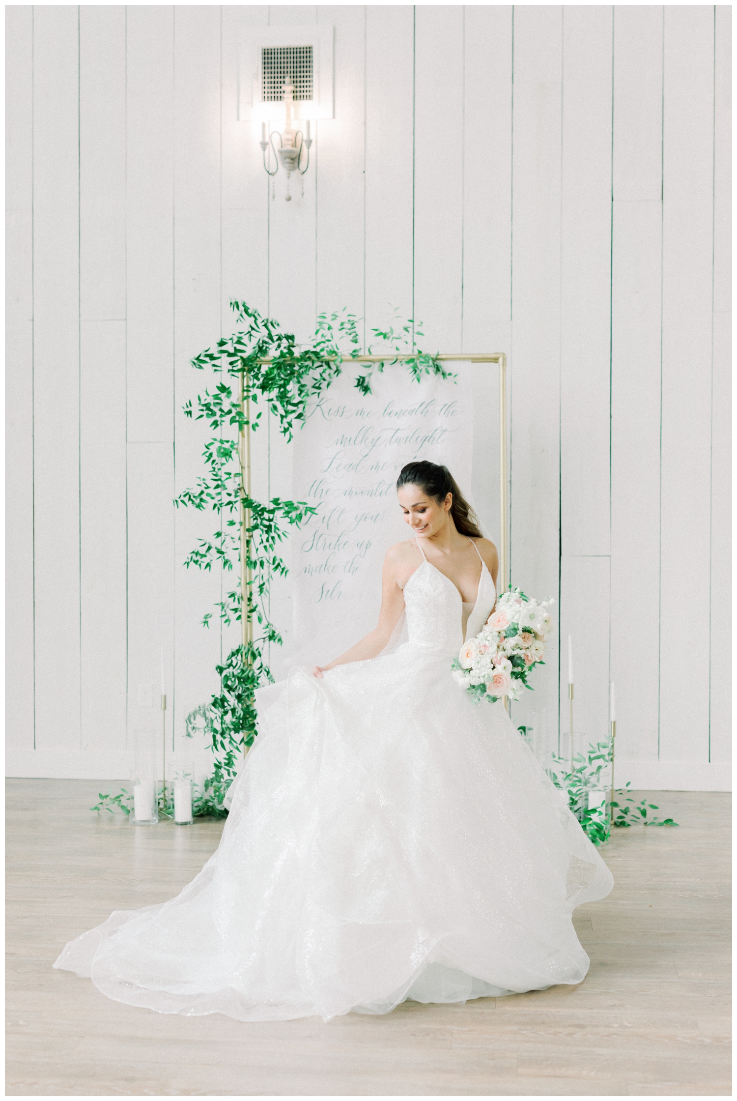 White barn venue with bride twirling her dress in Wallisville Texas