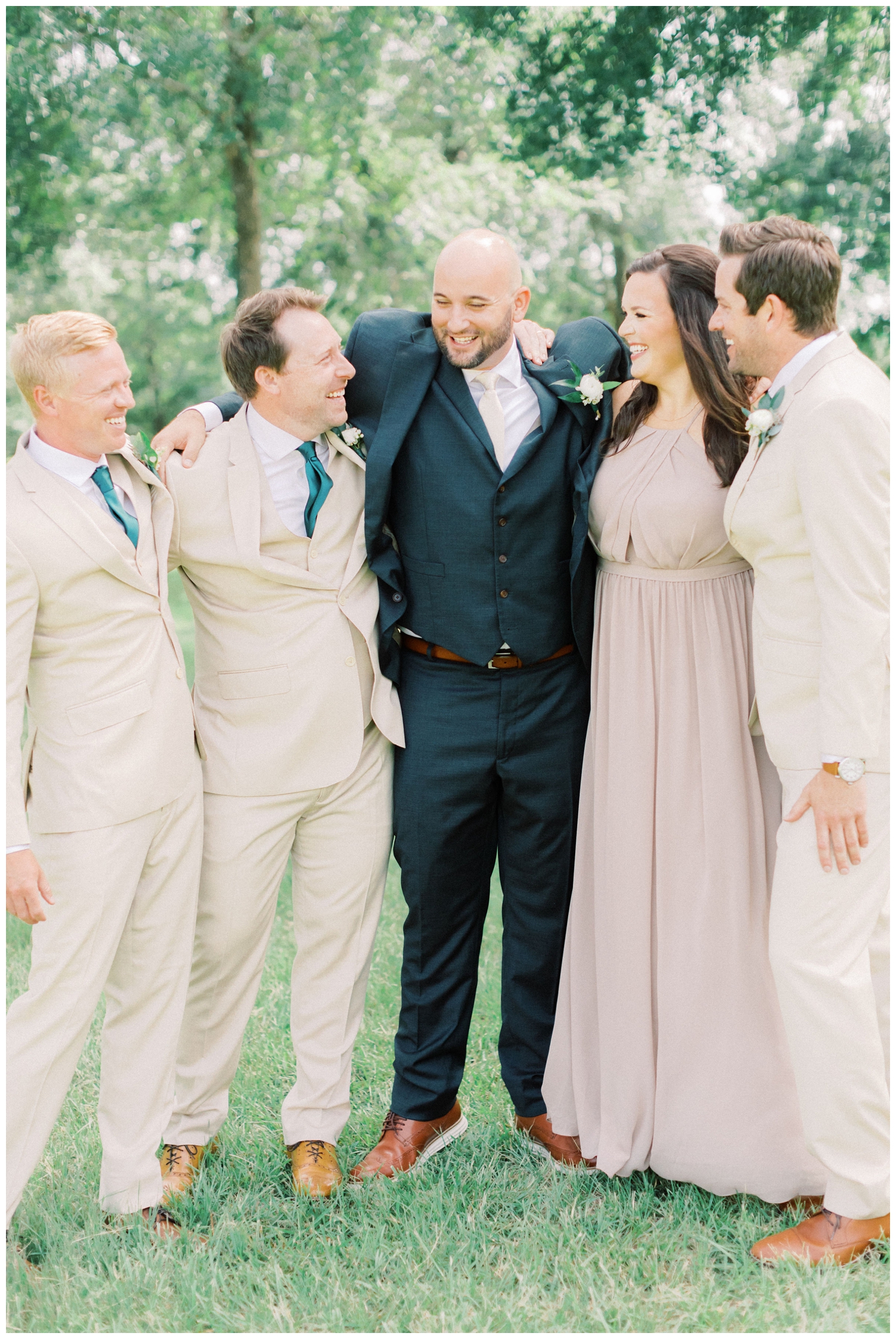 laughing-groom-with-groomsmen