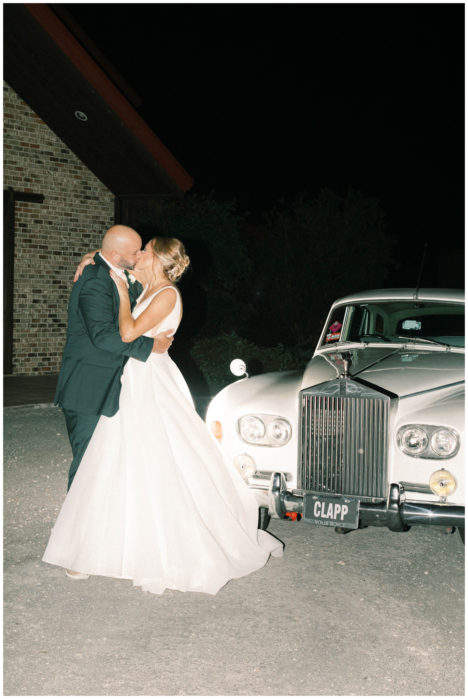 bride-groom-in-front-of-getaway-car-kissing