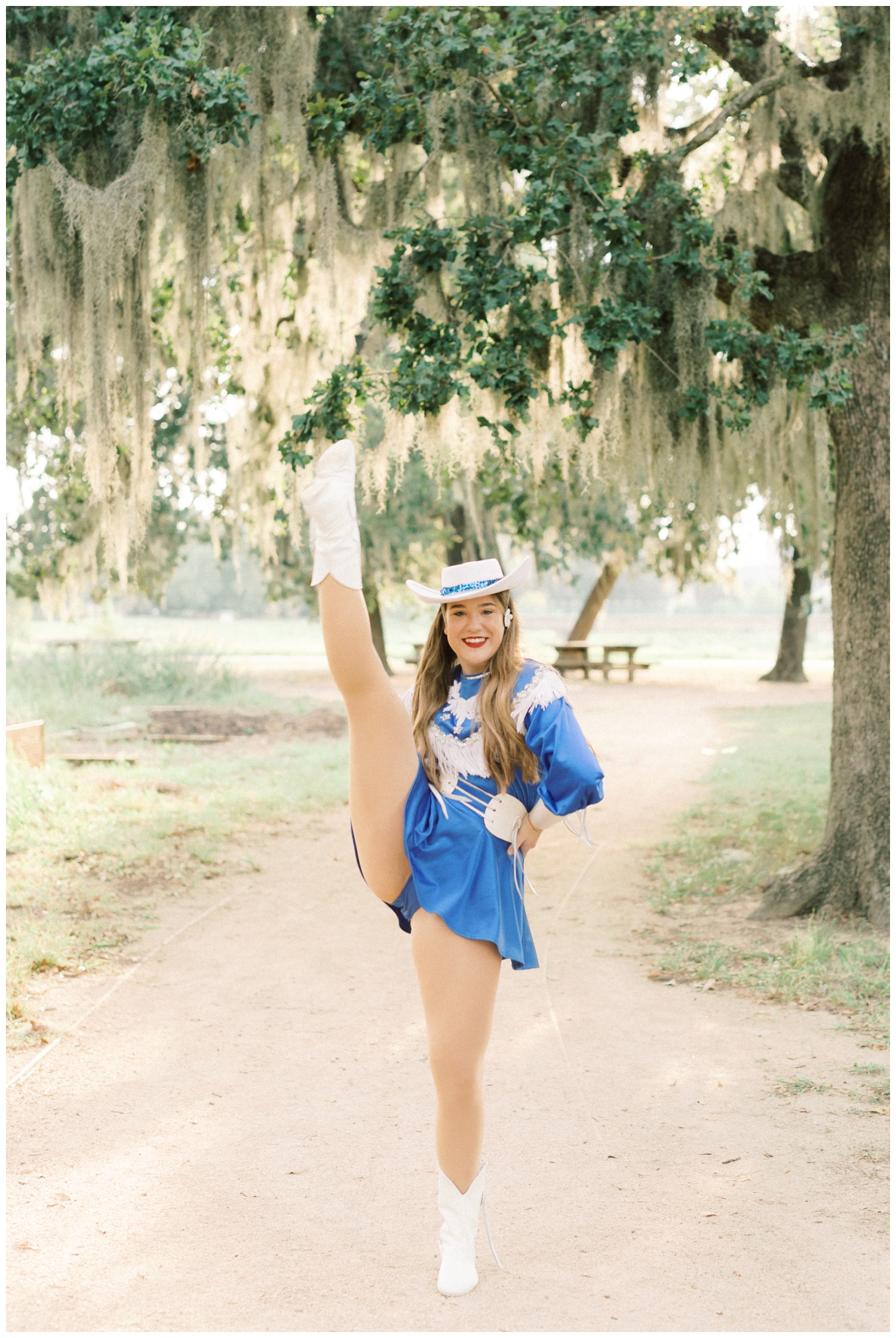 dancer doing high kick in a Houston Park with Reed Gallagher Photography