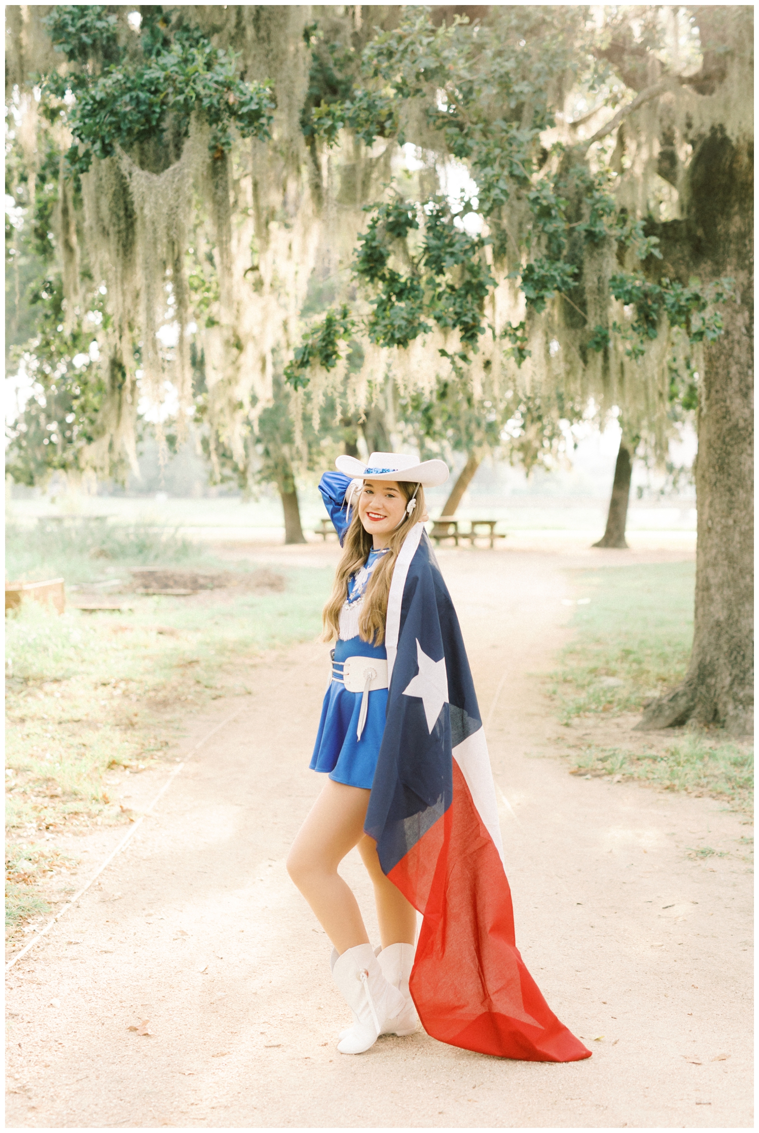 drill team dancer posing with a flag Houston Reed Gallagher Photography