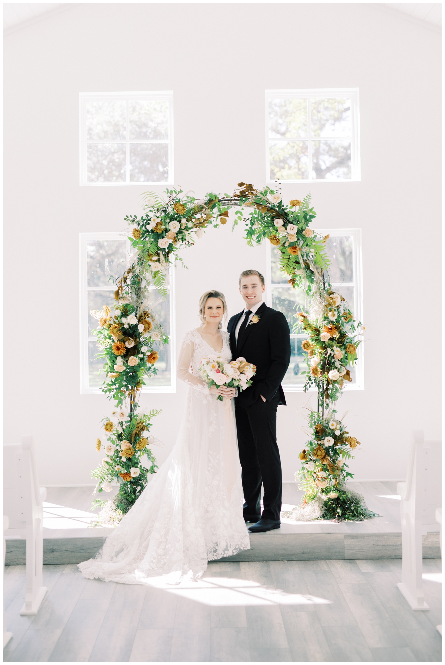 bride groom floral arch wedding chapel