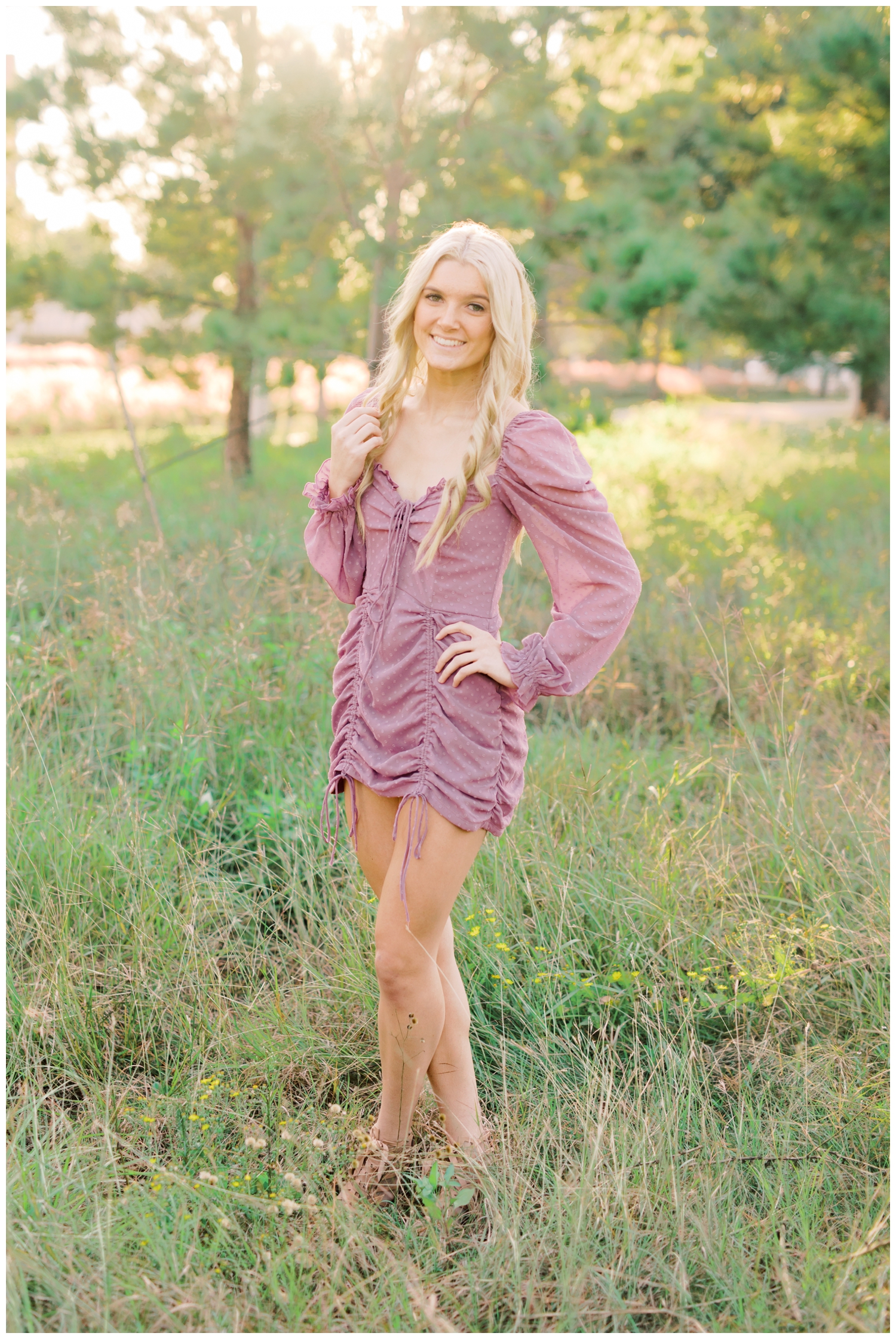high school senior girl posing in a field for a Houston Senior Photographer at Eleanor Tinsley park