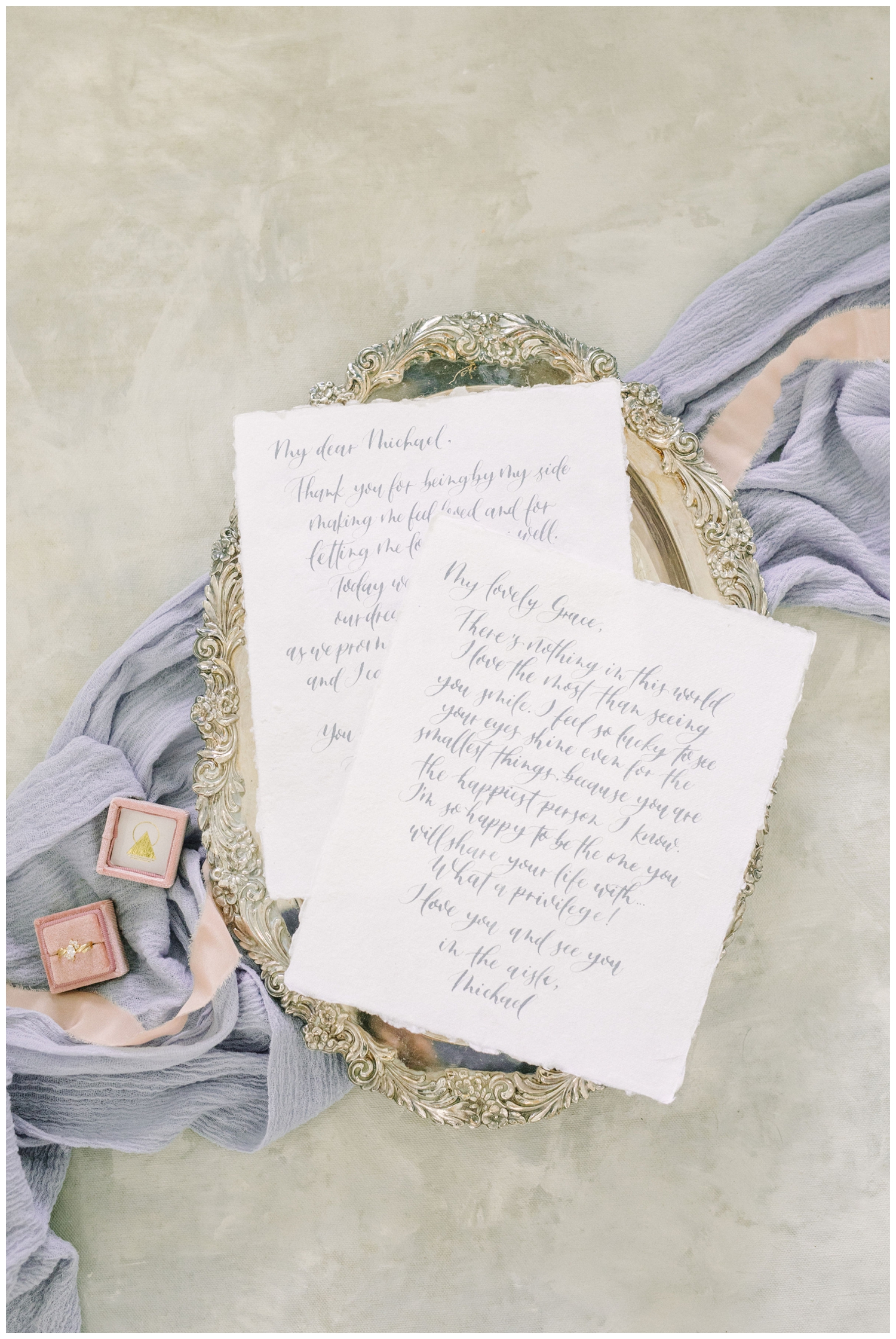 wedding flat lay of love letters written by a bride and groom
