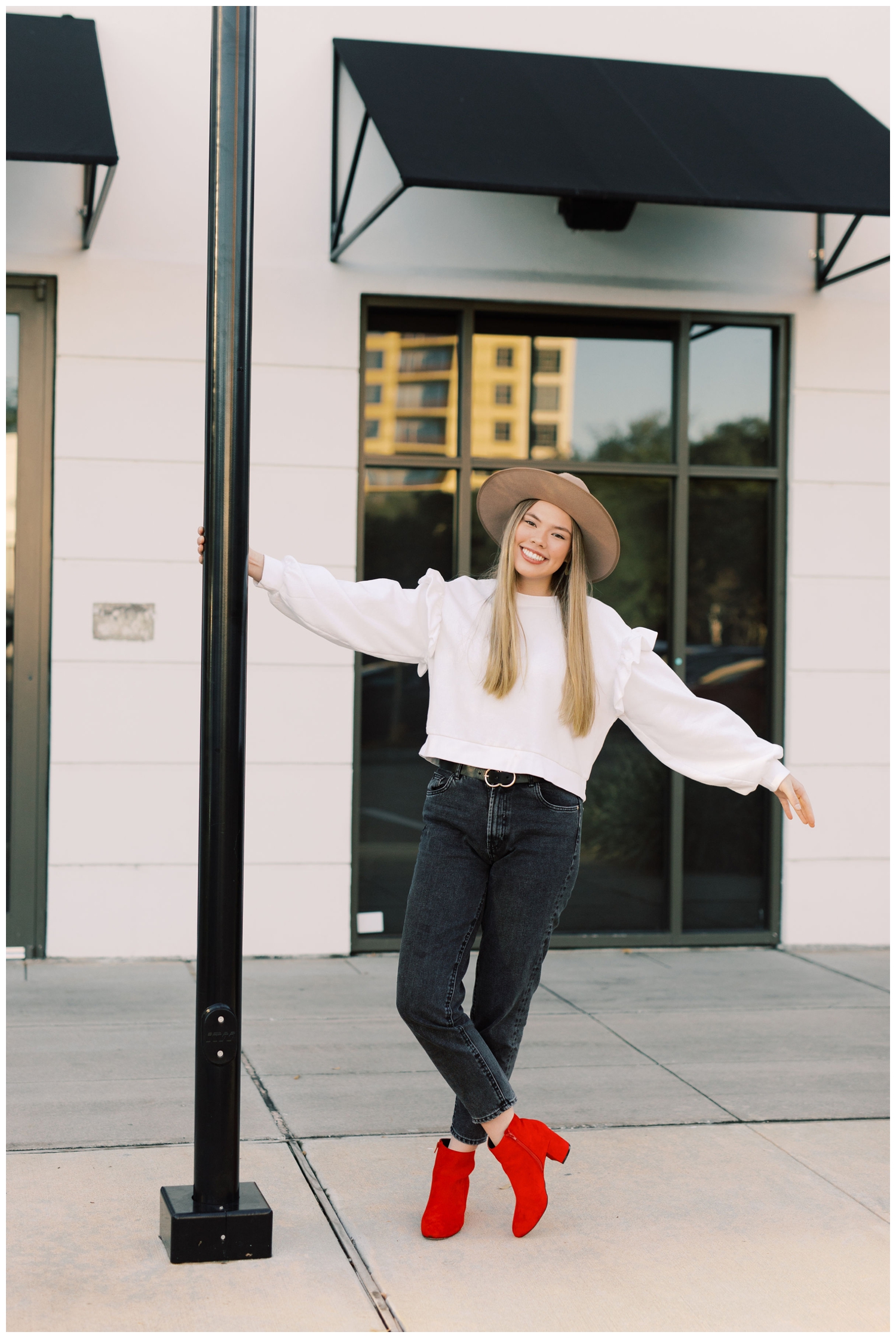 girl leaning on lamp post in Houston Texas