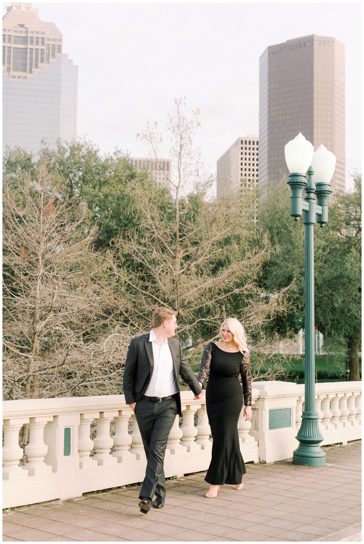 engaged couple in black dress and suit on Sabine Bridge downtown Houston