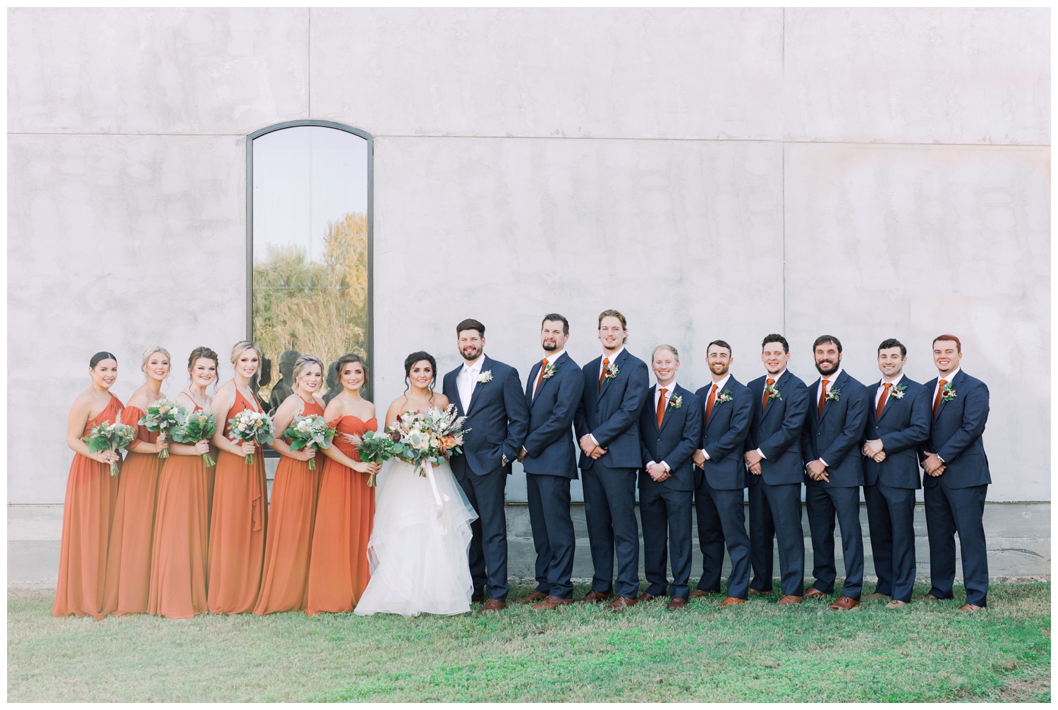 bridal party portraits on the lawn at Olde Dobbin Station in Montgomery, Texas