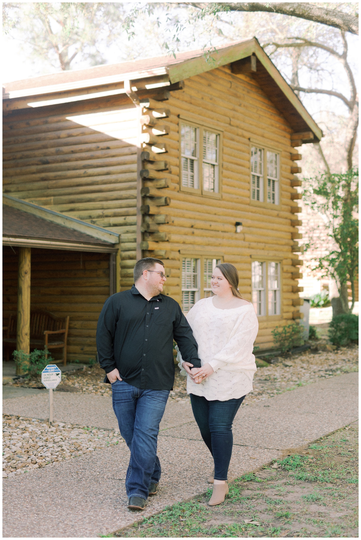 couple walking for engagement session in Cypress Texas