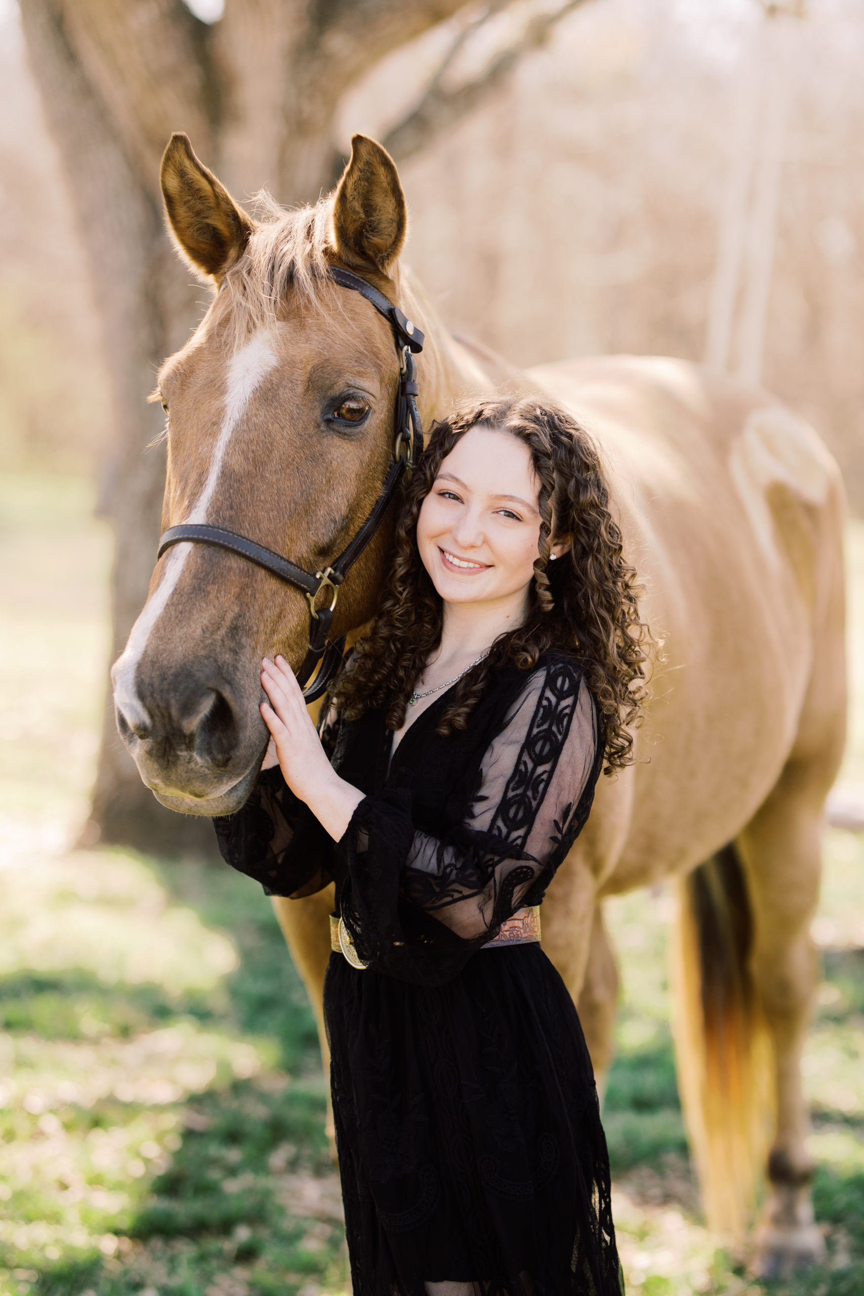 girl standing next to a horse at a farm in Houston