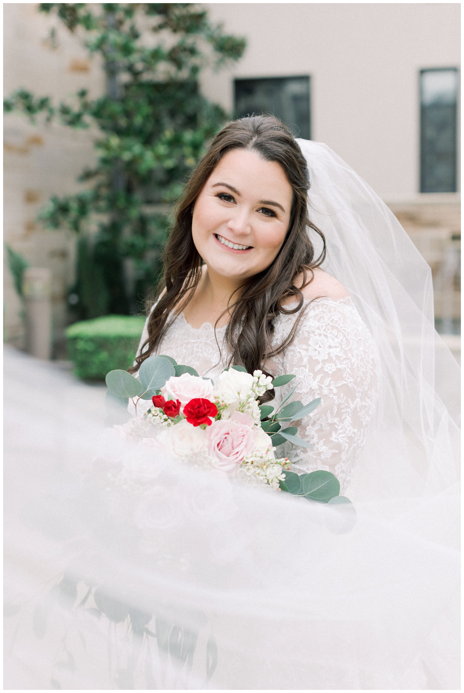 bride smiling with veil swoop