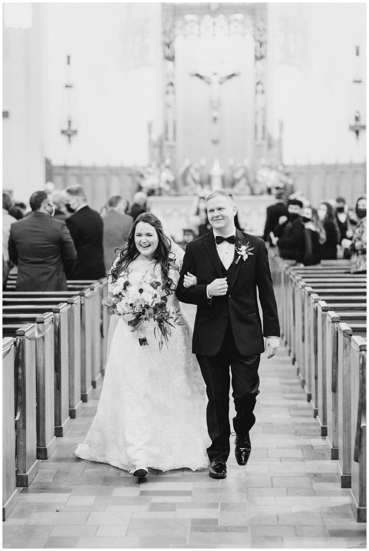bride and groom exiting ceremony inside Holy Rosary Church