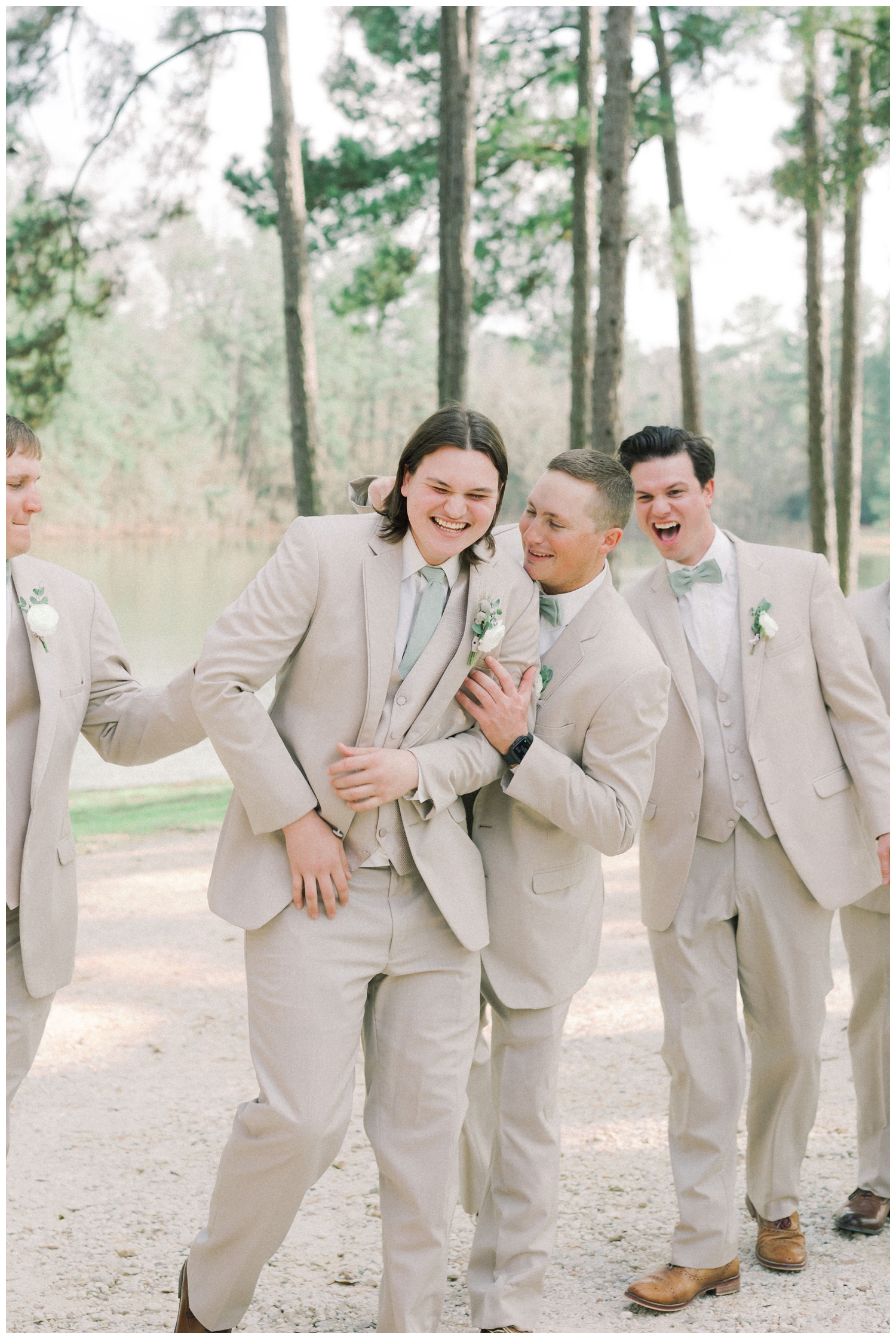 groom with groomsmen laughing