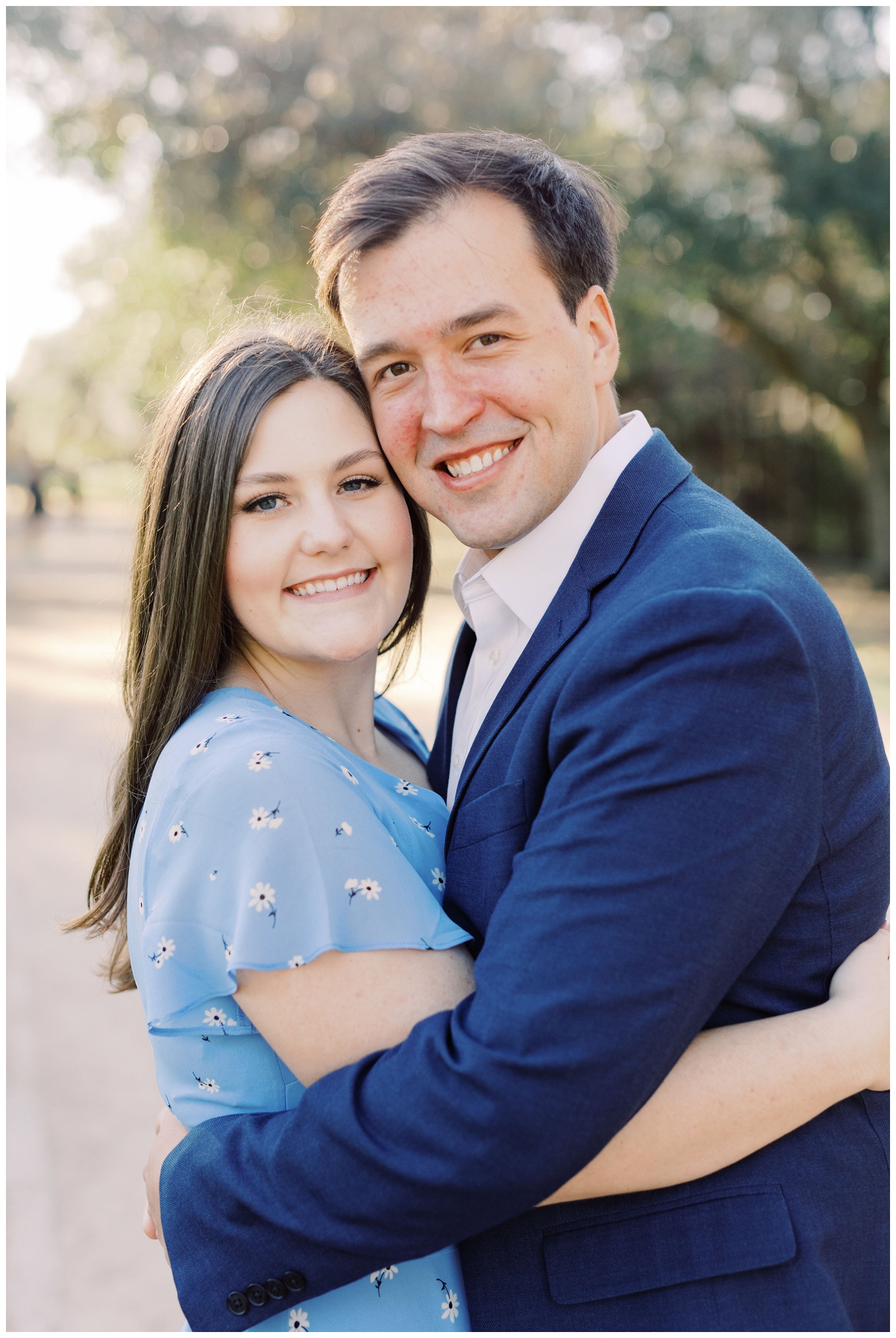 couple hugging for a Houston Engagement Photographer