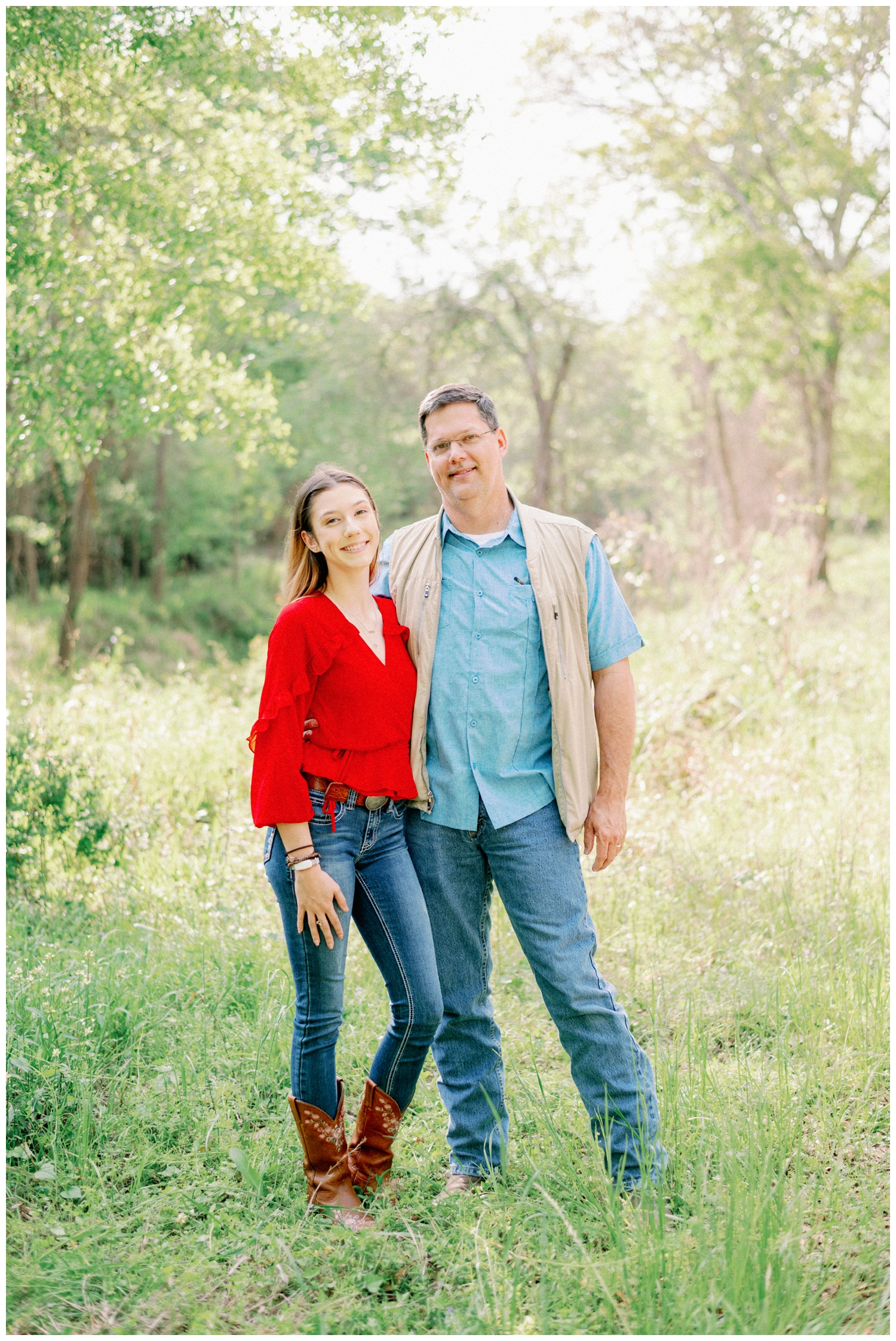 girl hugging her dad in a field for a Cypress Senior Photographer at Cy-Hope