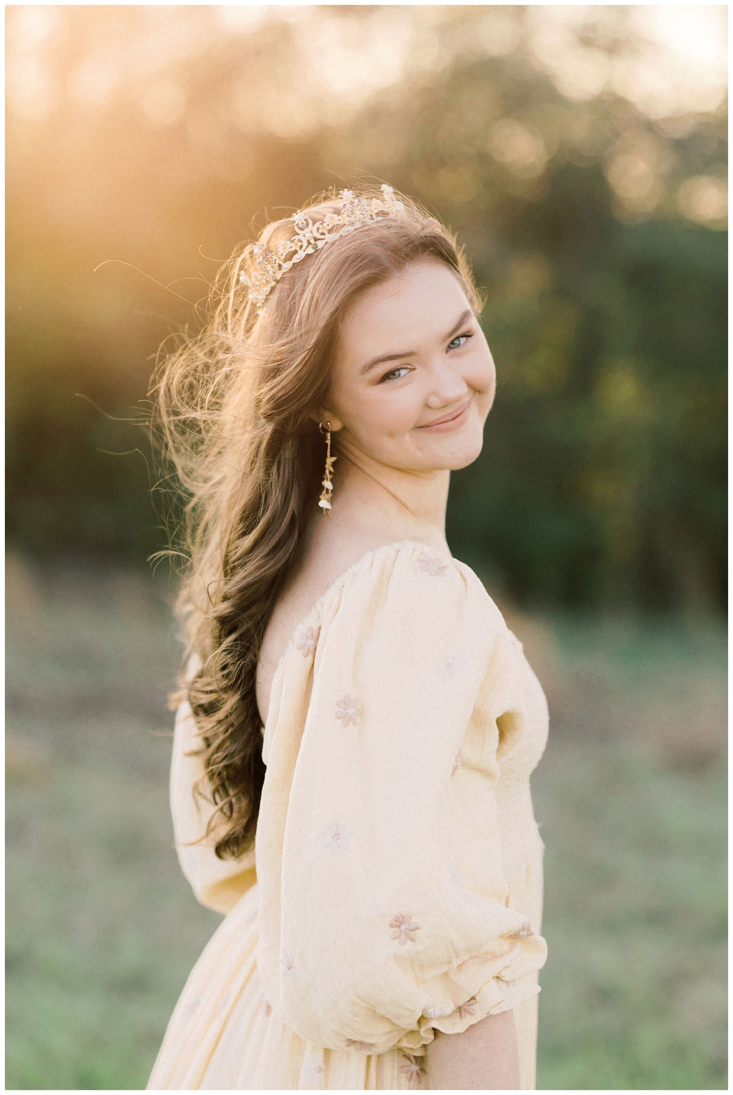 close up of a high school senior in a yellow dress posing for aHouston outdoor senior photographer