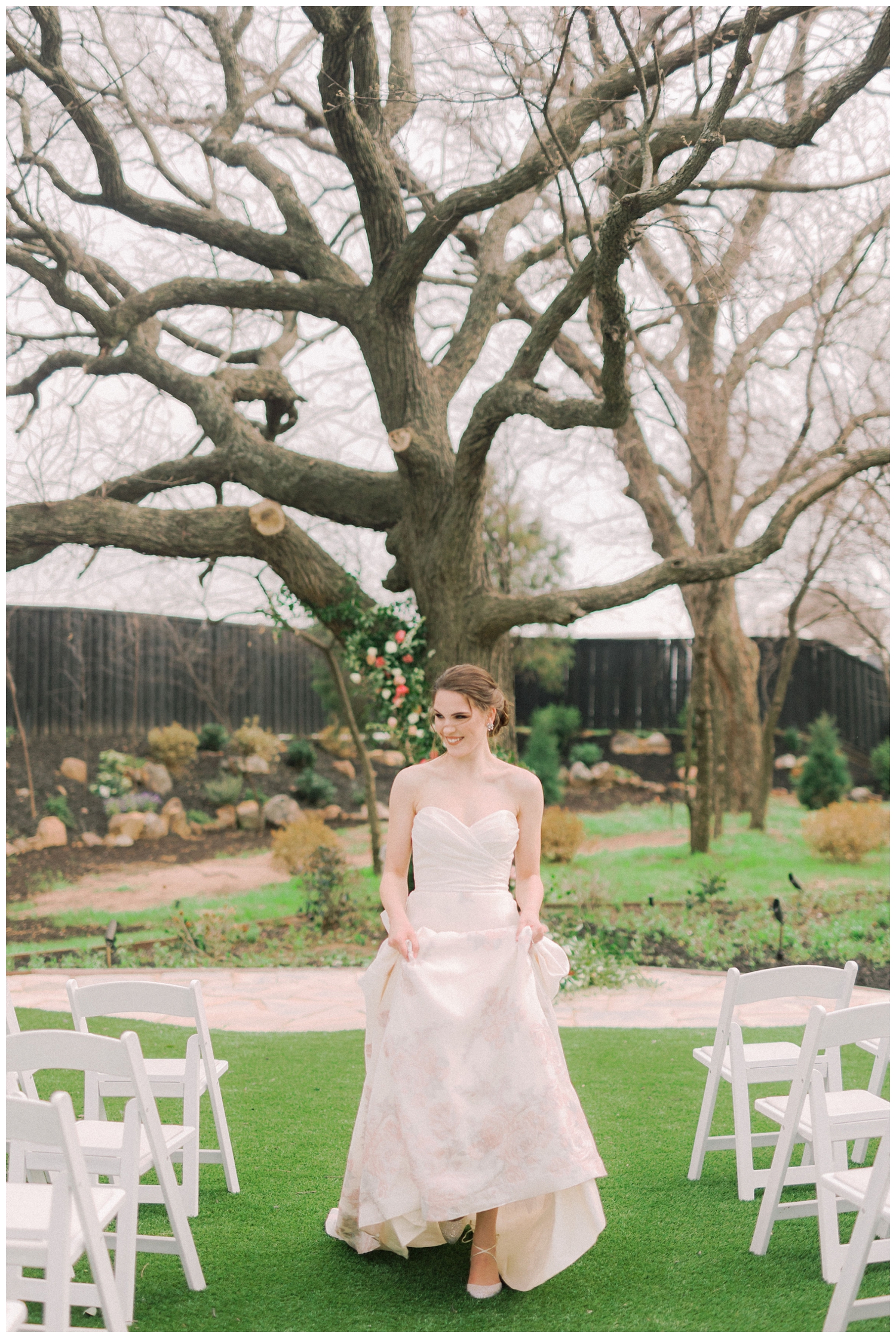 bride skipping through ceremony space outdoors at Brighton Abbey wedding venue