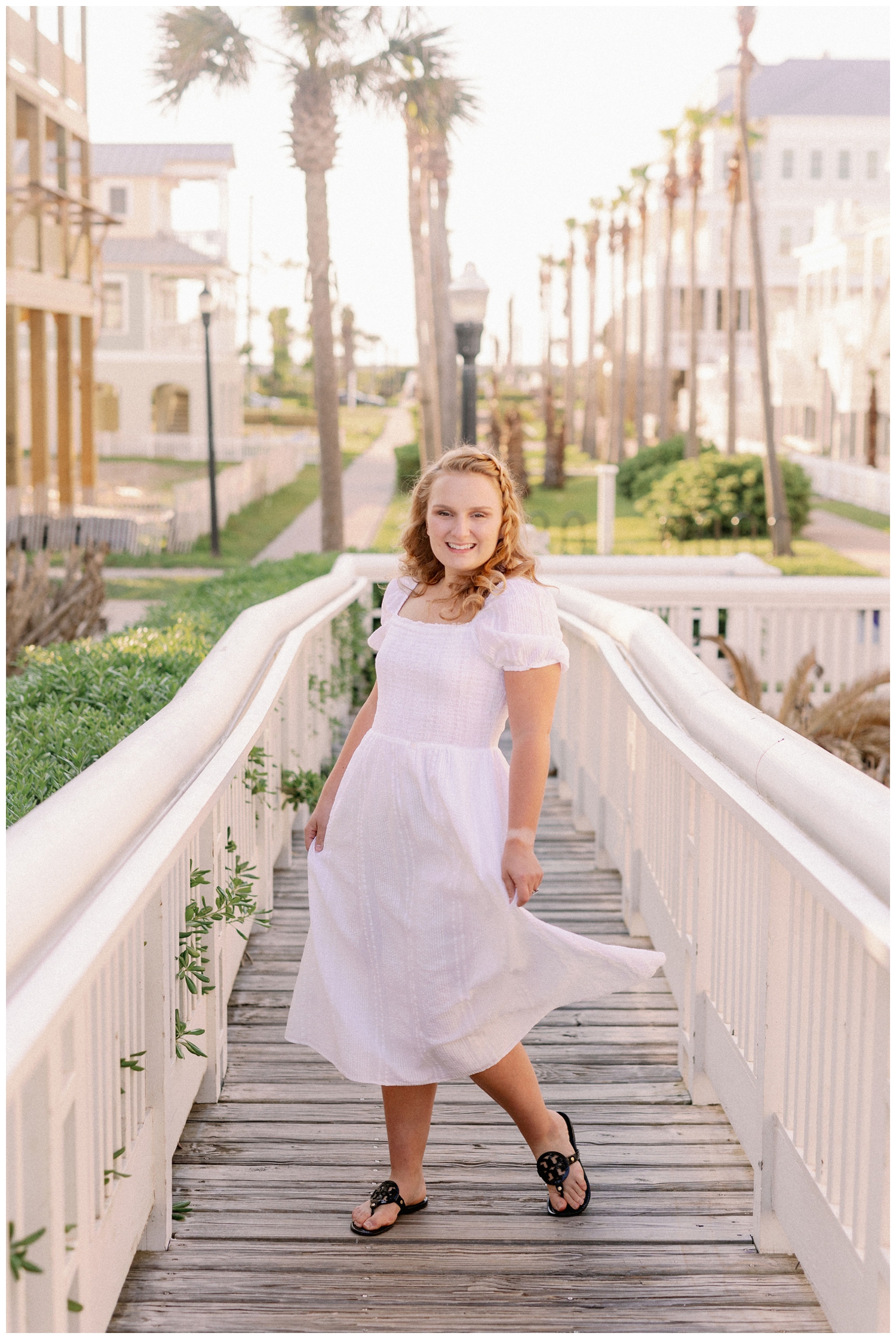 girl in white dress on boardwalk in Galveston, Texas