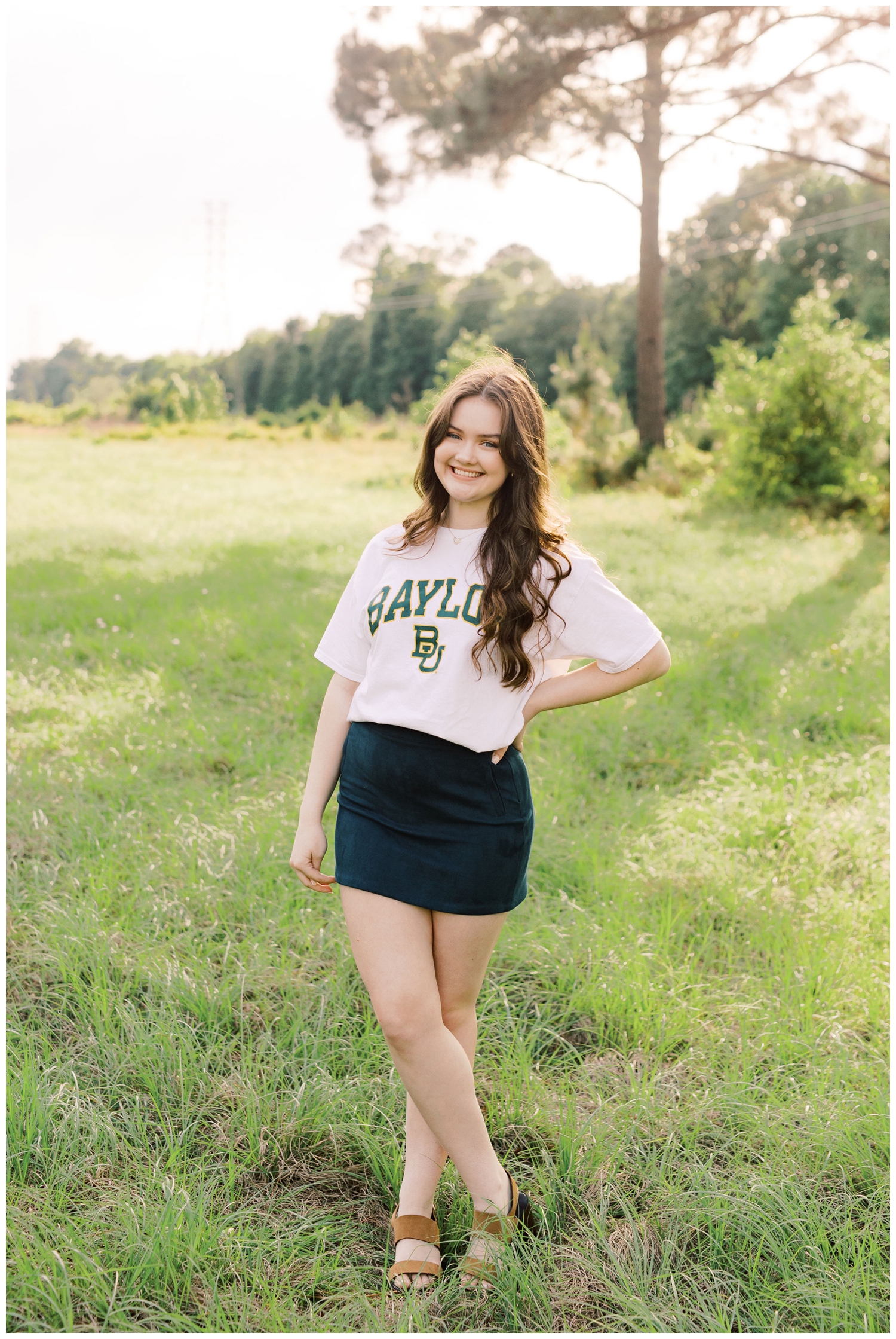 girl standing in a field in Baylor tshirt for Houston Senior Model Team
