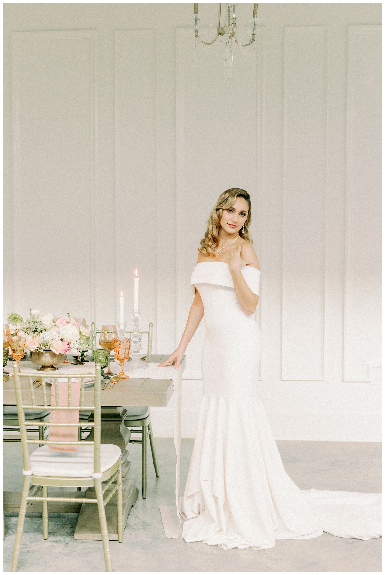 bride standing at farmhouse reception table inside The Peach Orchard , The Woodlands, Texas