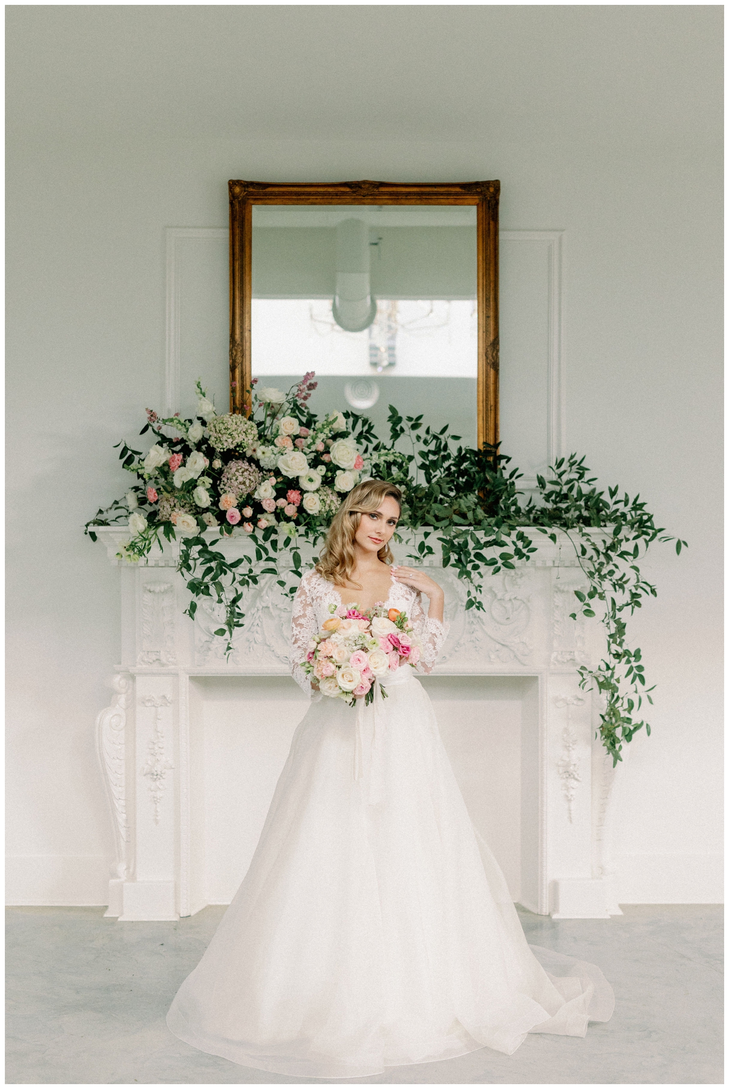 gold mirror on mantle with florals at The Peach Orchard with bride standing in front
