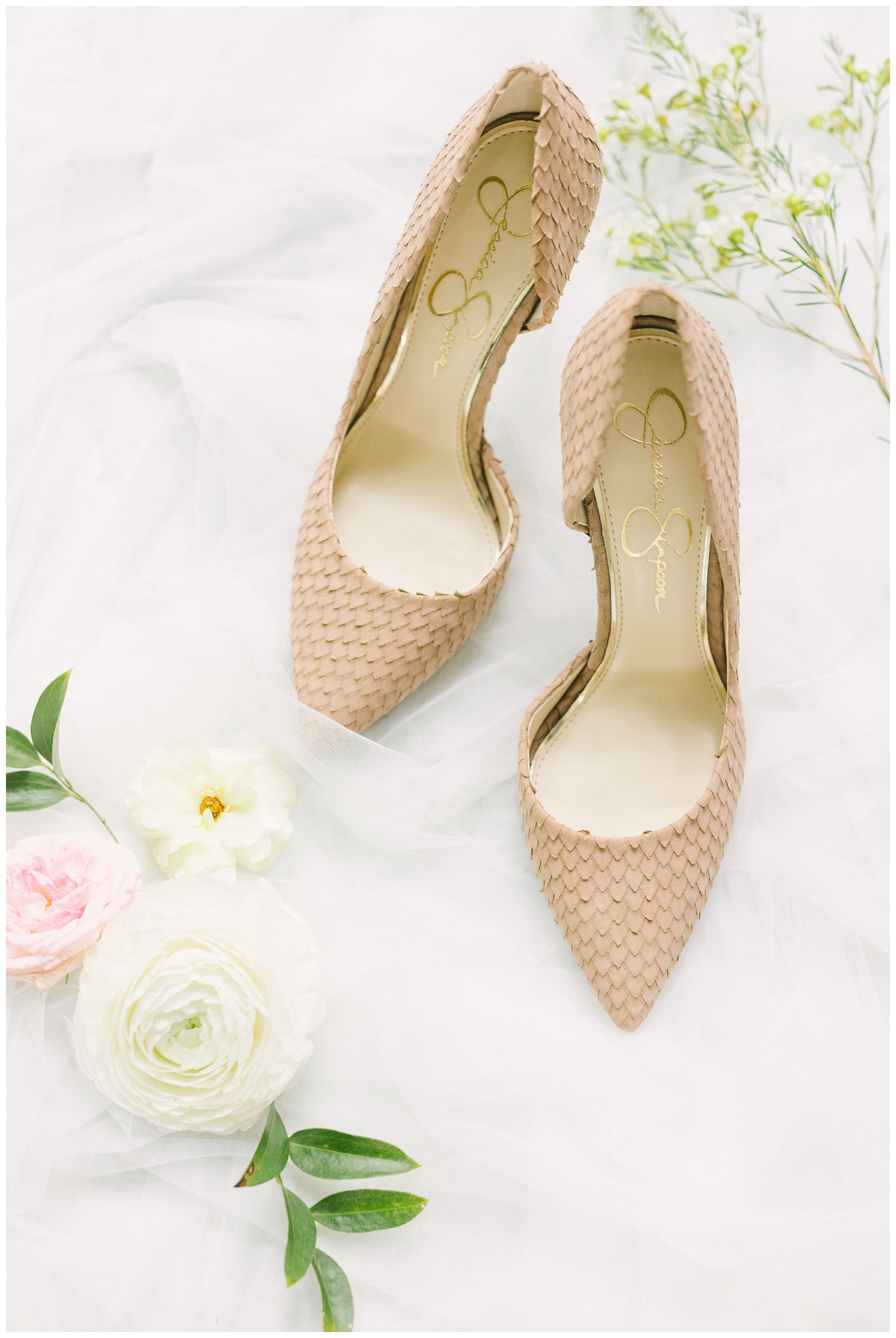peach heel flatlay with white florals