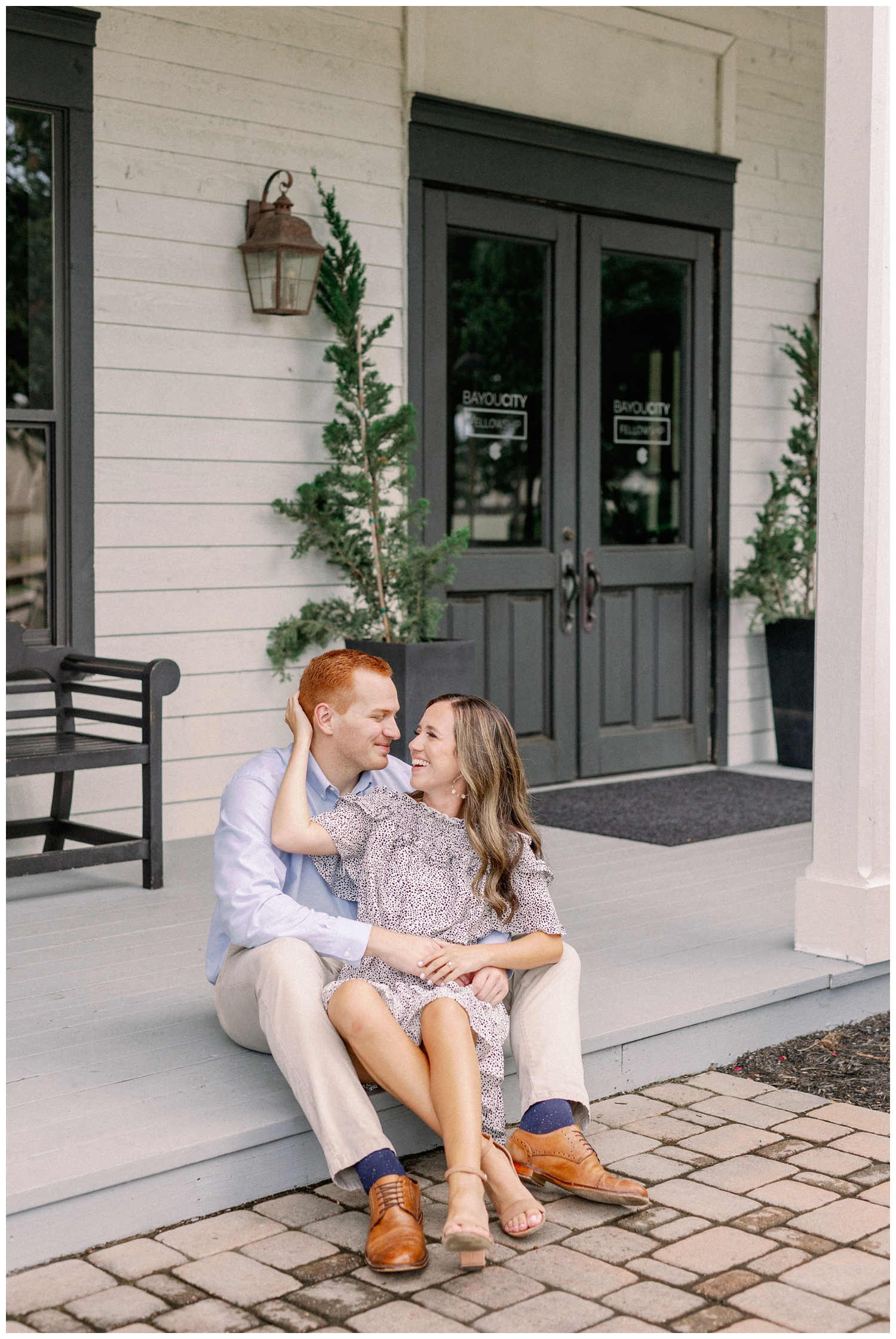 couple sitting in front of Cy-Hope for Cypress engagement photographer