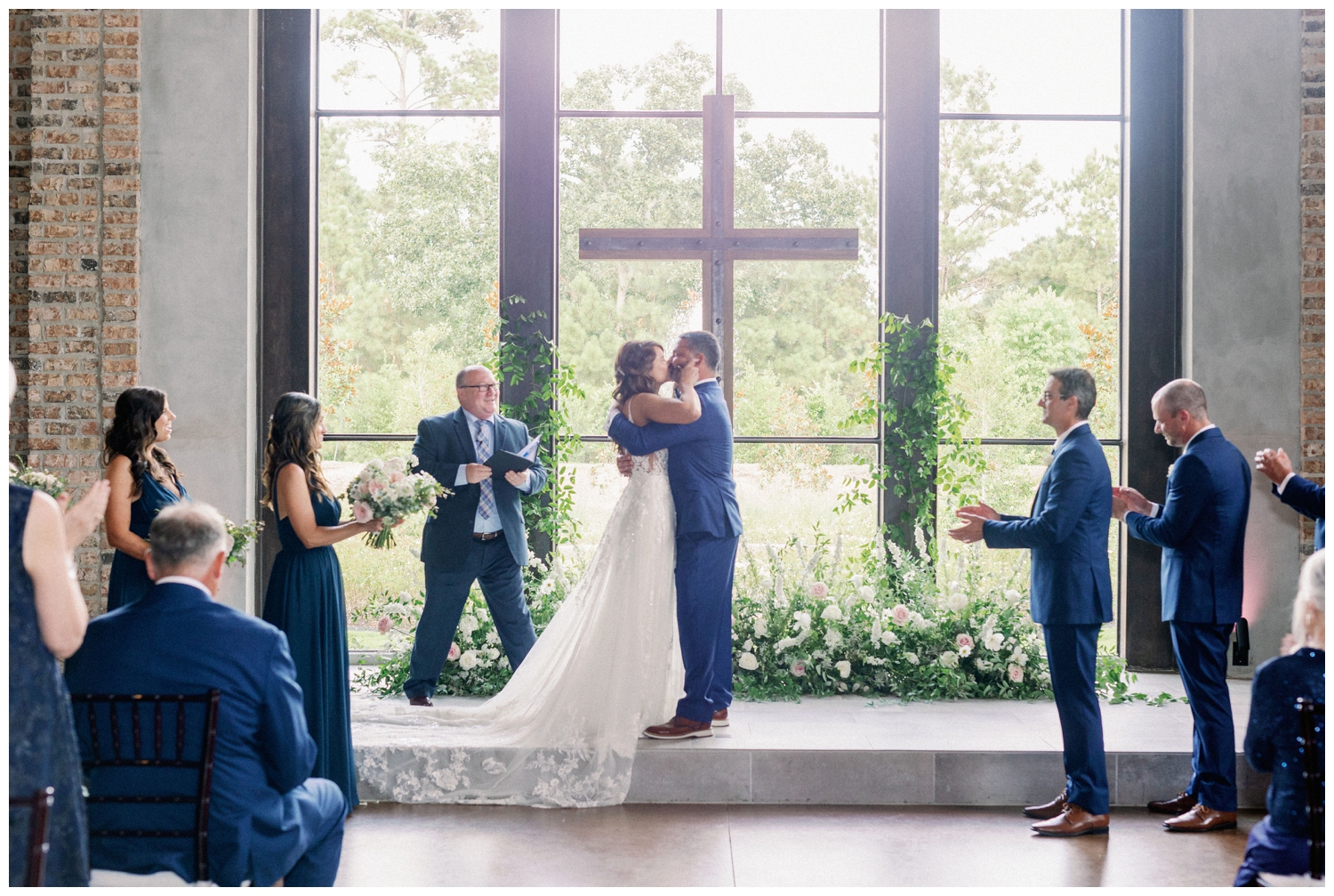 newlyweds kissing during Iron Manor wedding ceremony