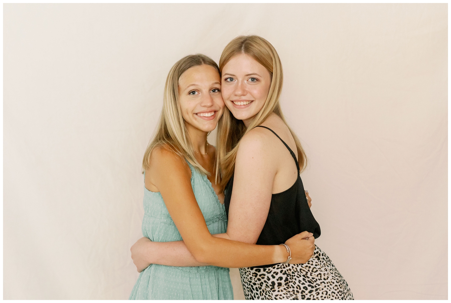 senior girls hugging for portrait