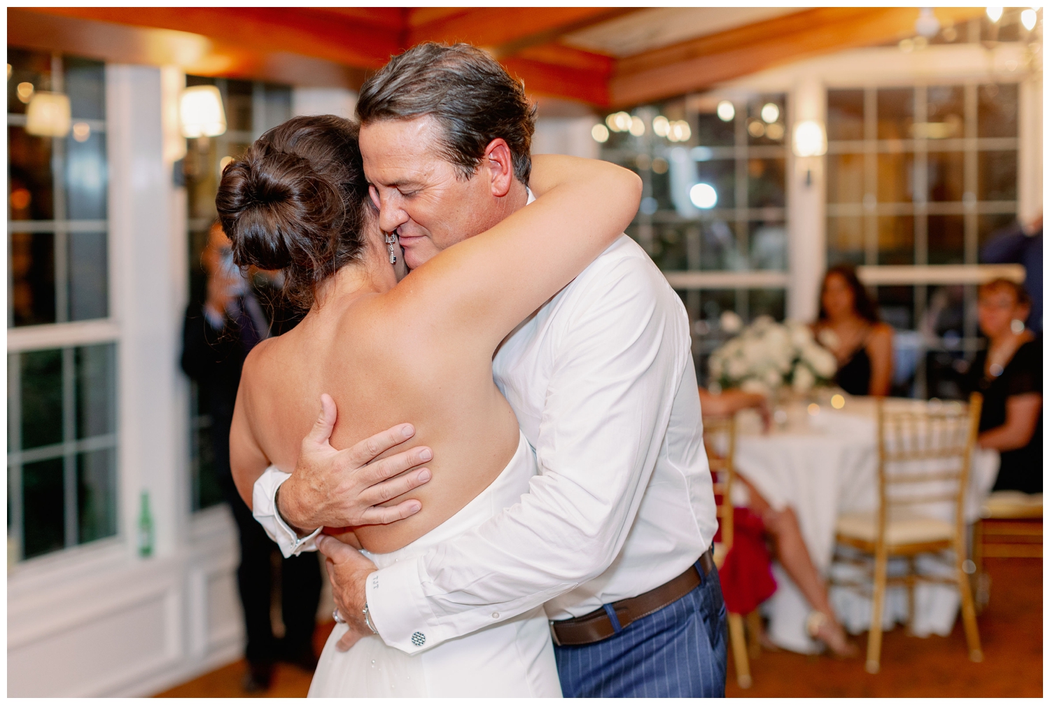 bride and groom hugging at The Manor house wedding reception