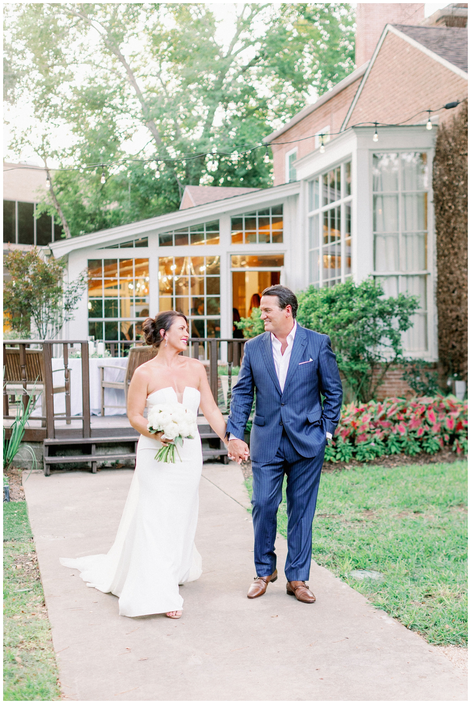 bride and groom holding hands and walking The Houstonian Hotel wedding