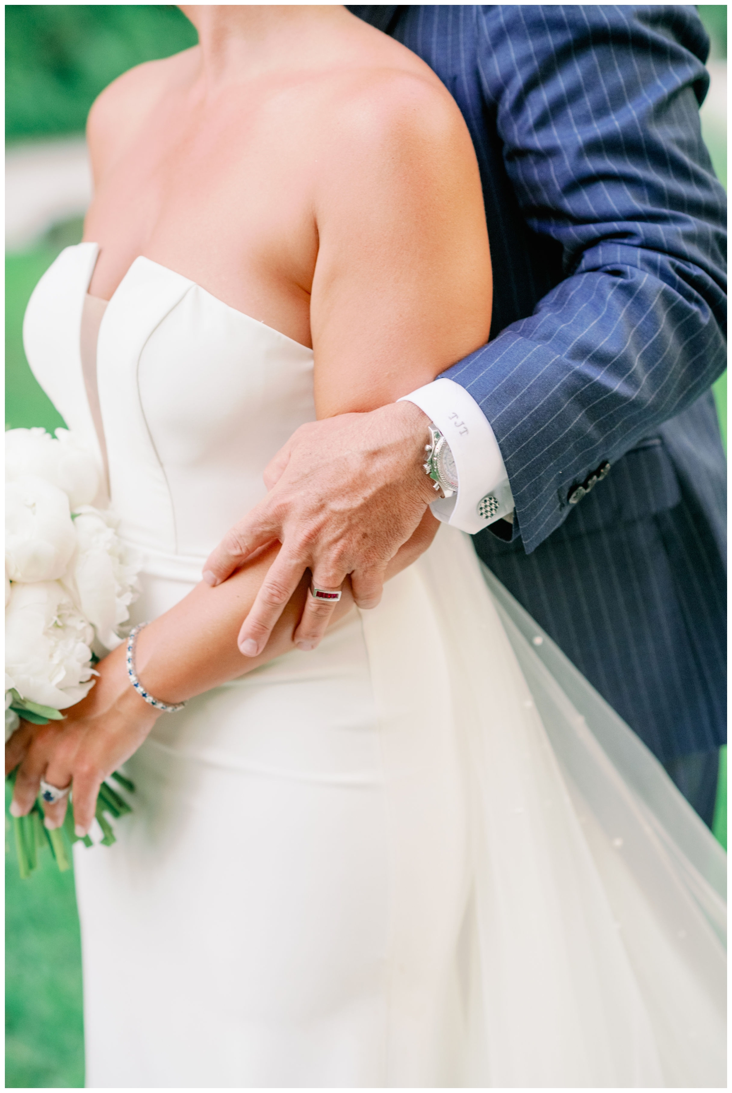 close up of bride and groom hands