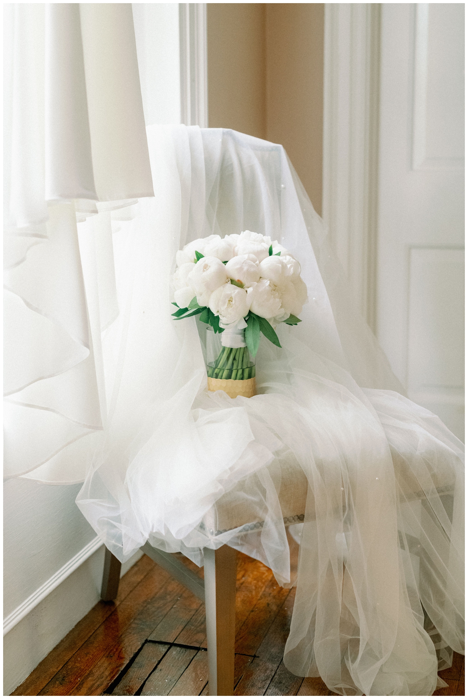 all white bouquet on veil inside The Houstonian Hotel wedding