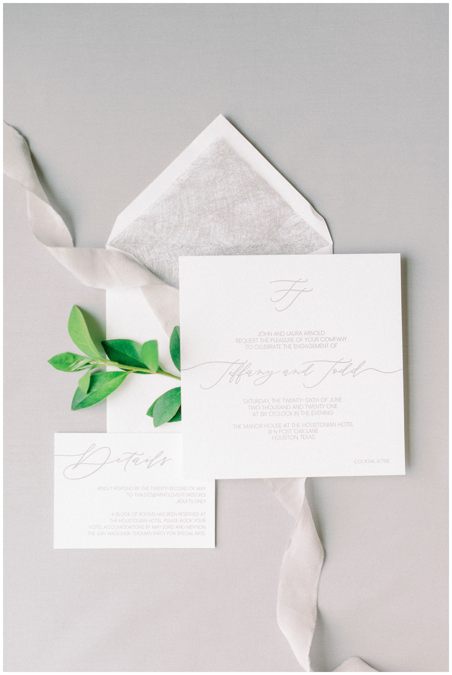all white invitation suite with silver etching