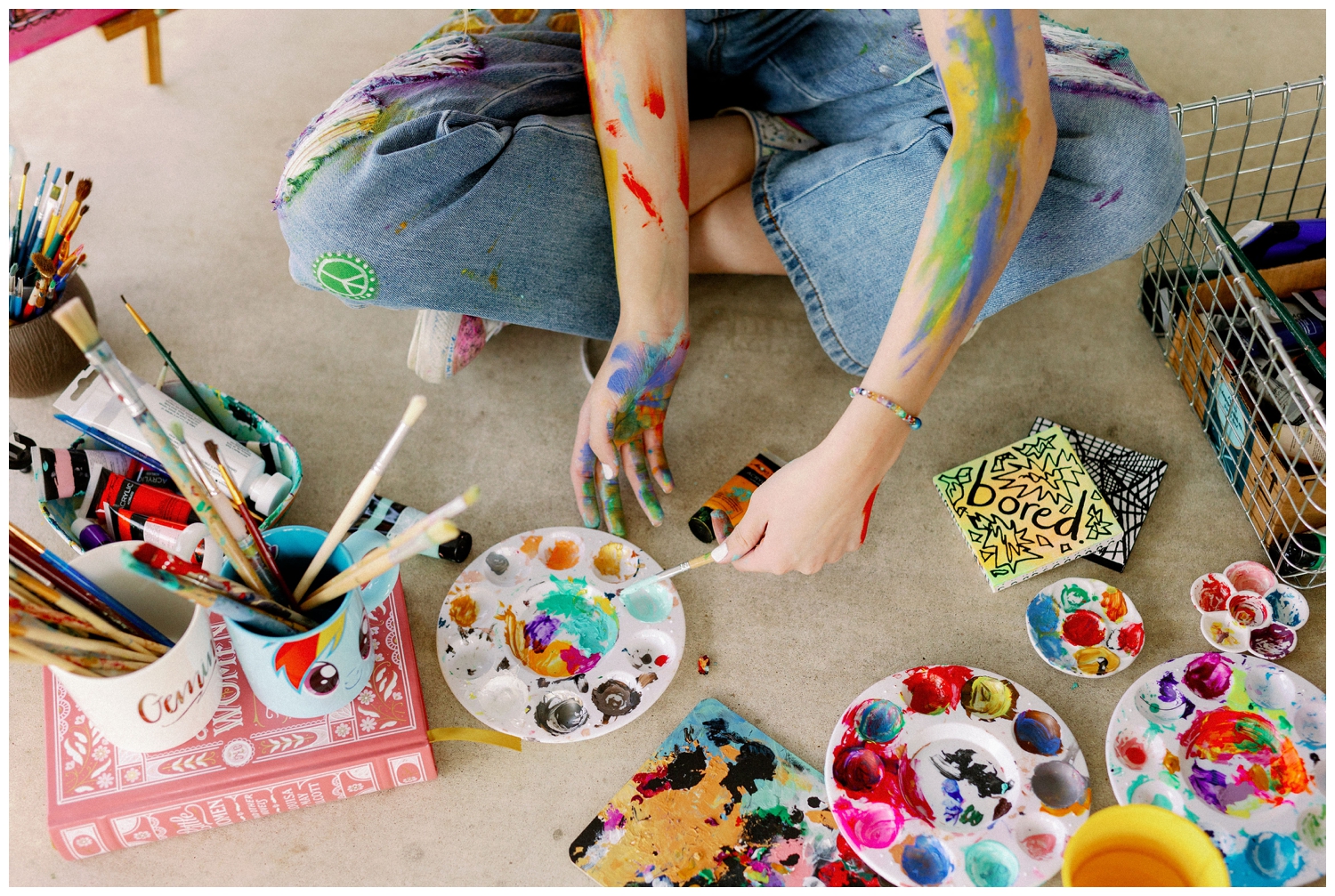 girl painting for colorful Houston senior photos