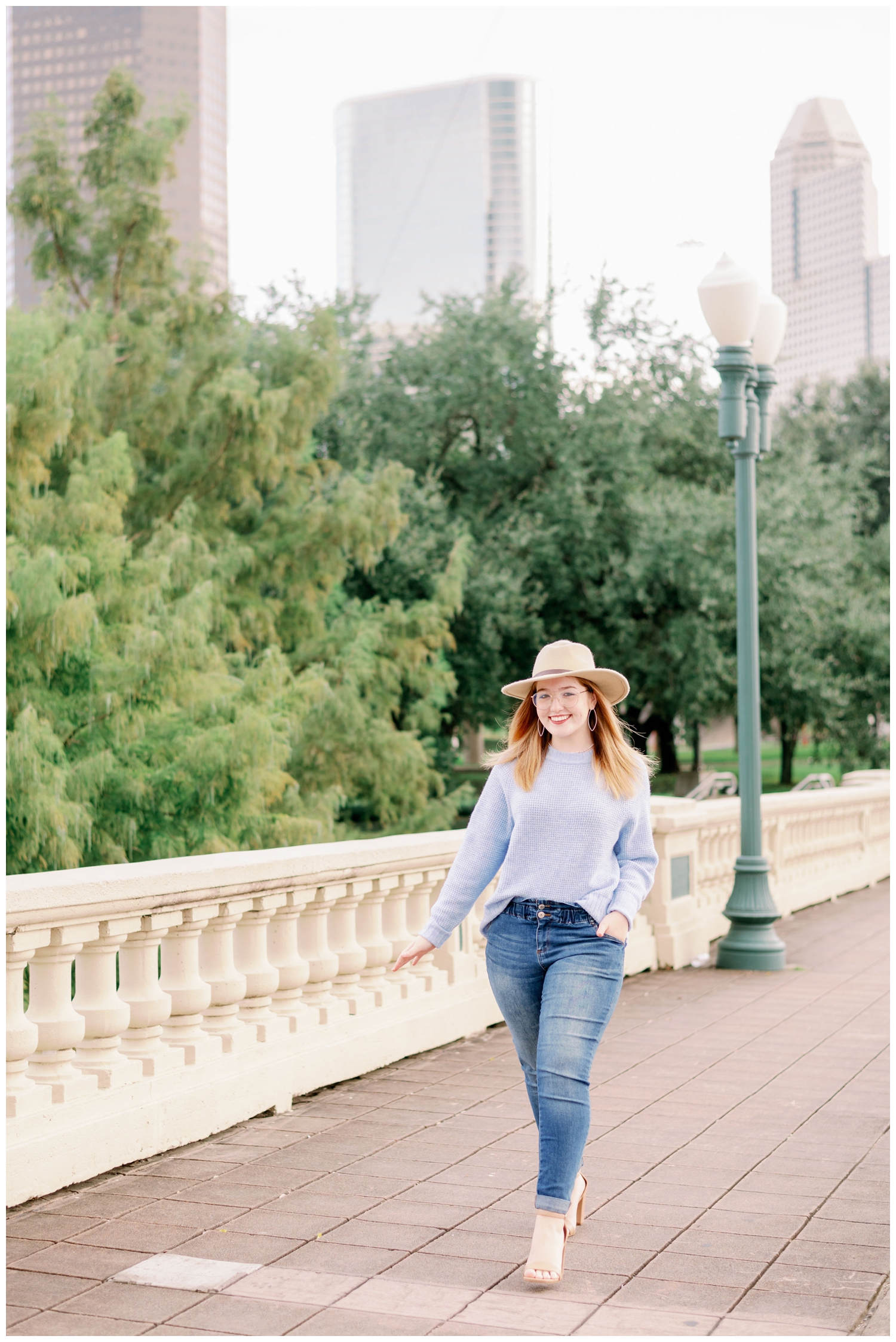 girl walking on Sabine Bridge for senior pictures downtown Houston