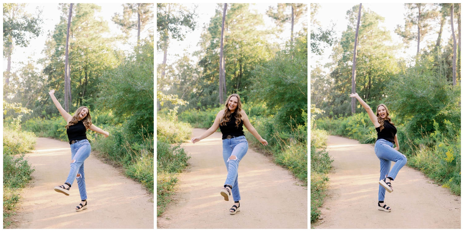 girl kicking and twirling in jeans and black top inside the Houston Arboretum