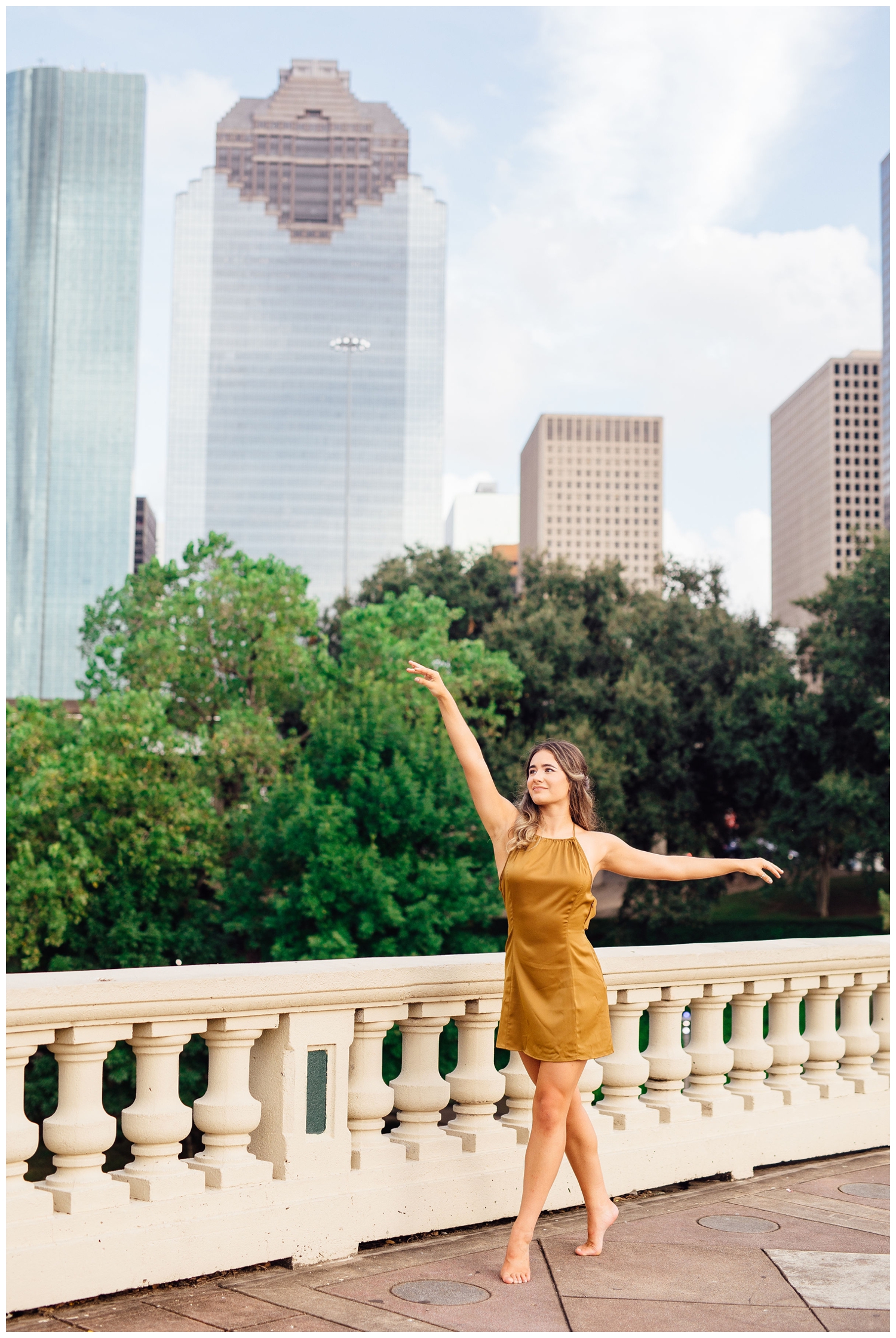 girl in dance pose with arms out for Houston senior dance photographer