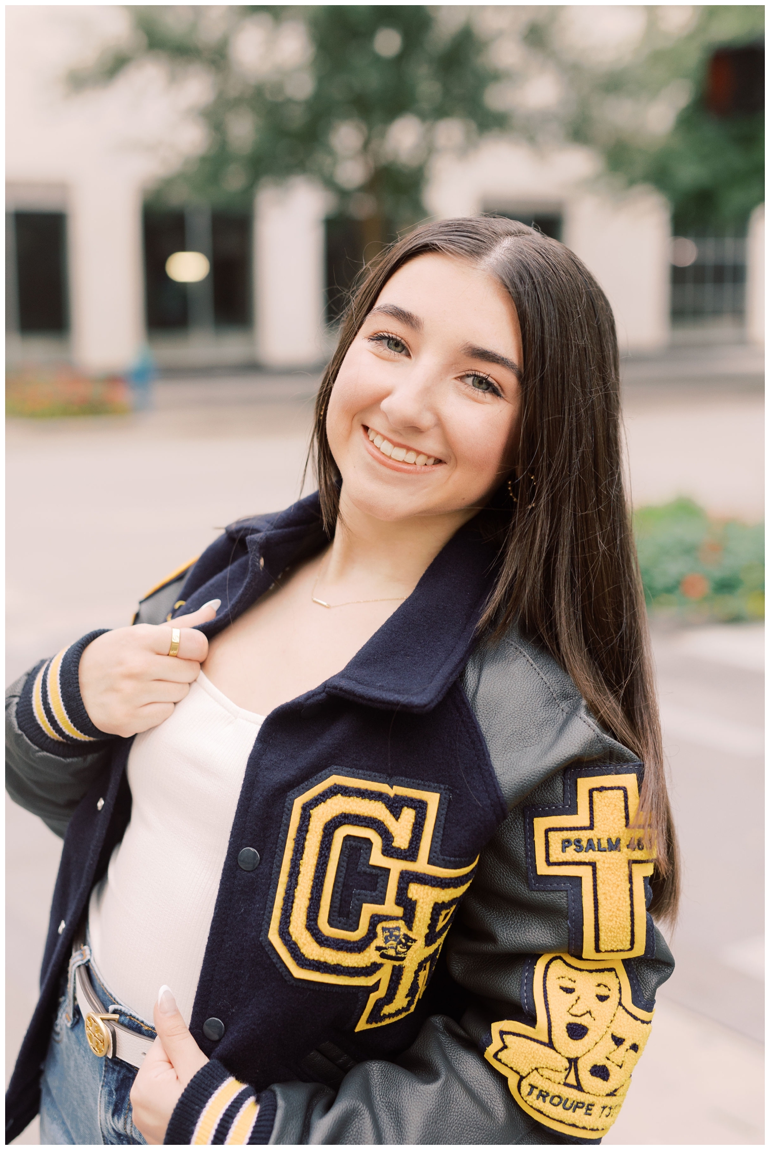 closeup of girl wearing letter jacket