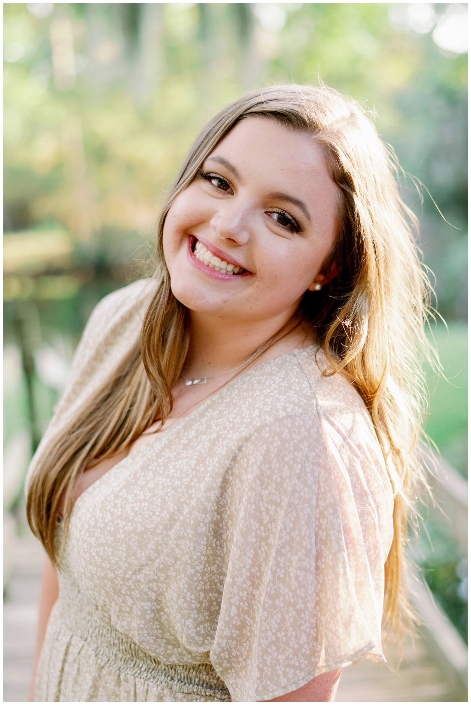 girl smiling at the camera for Cypress senior photography