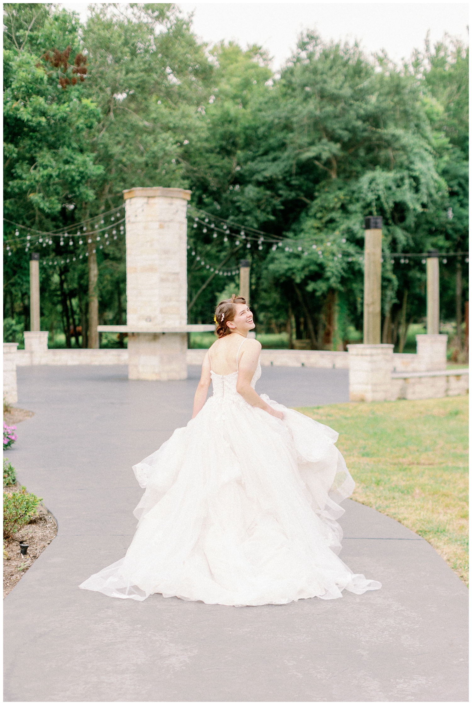 bride skipping in wedding gown at The Oaks at Oak Plantation wedding