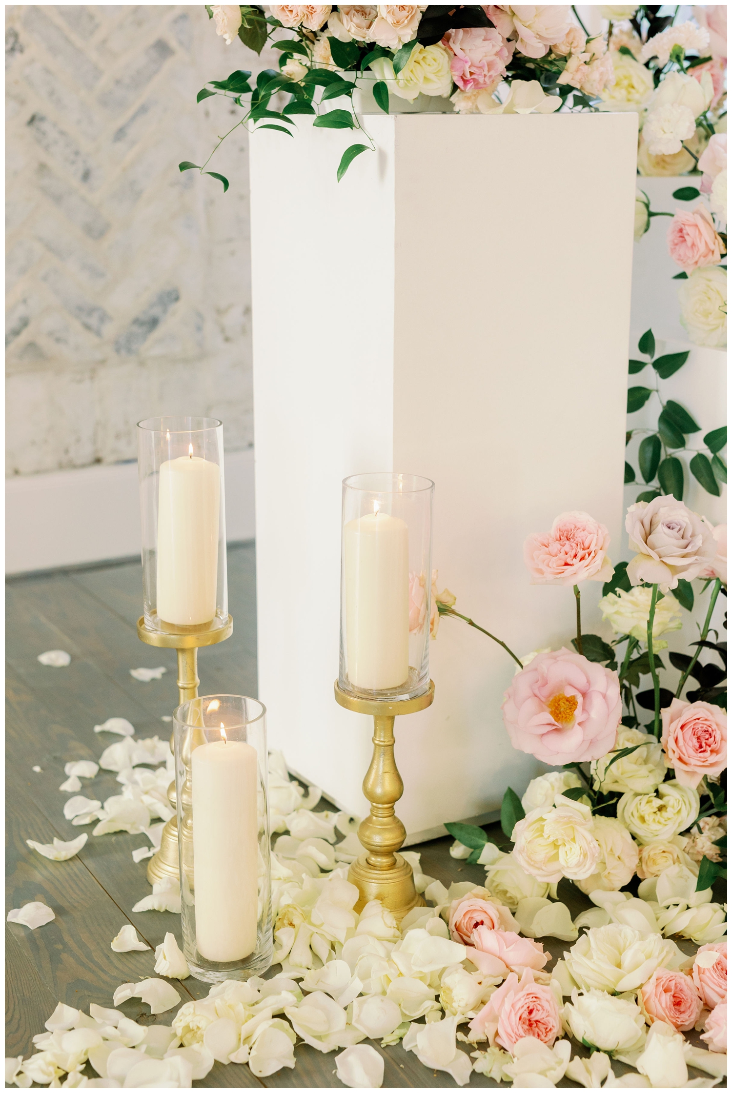 white candles with pink roses for The Peach Orchard Venue wedding editorial