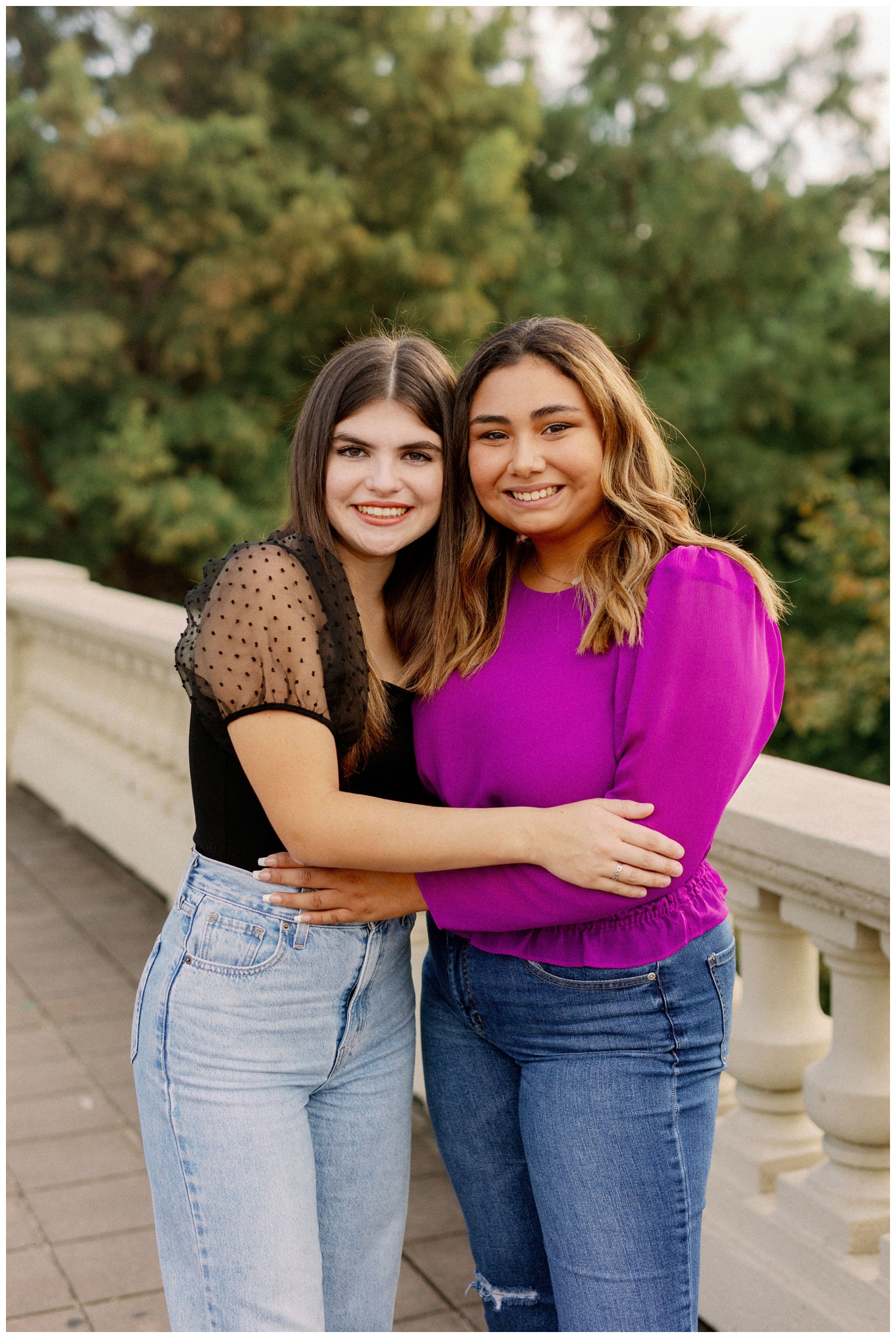 best friends senior session portrait with two girls hugging