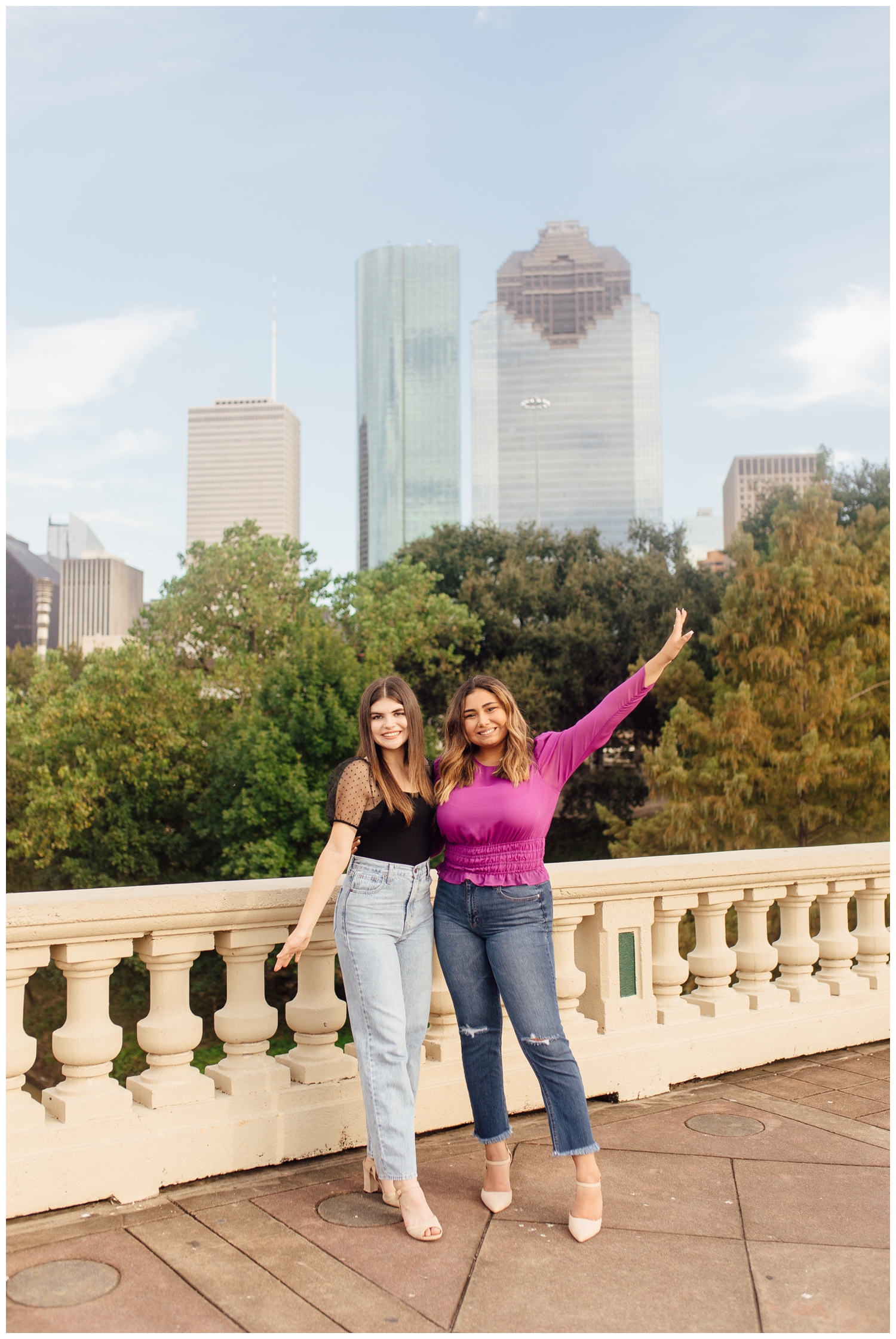 best friends senior session with two girls in front of Houston skyline