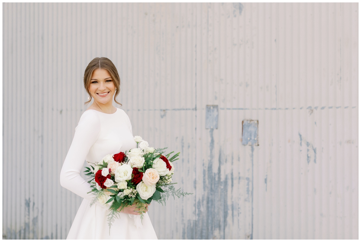 bride in long sleeve wedding gown holding bouquet for College Station Bridal Portraits