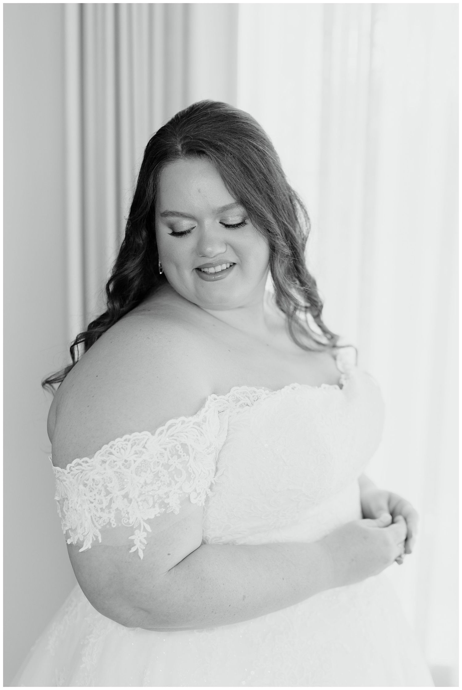 bridal portrait with bride looking over shoulder for College Station wedding photographer in black and white