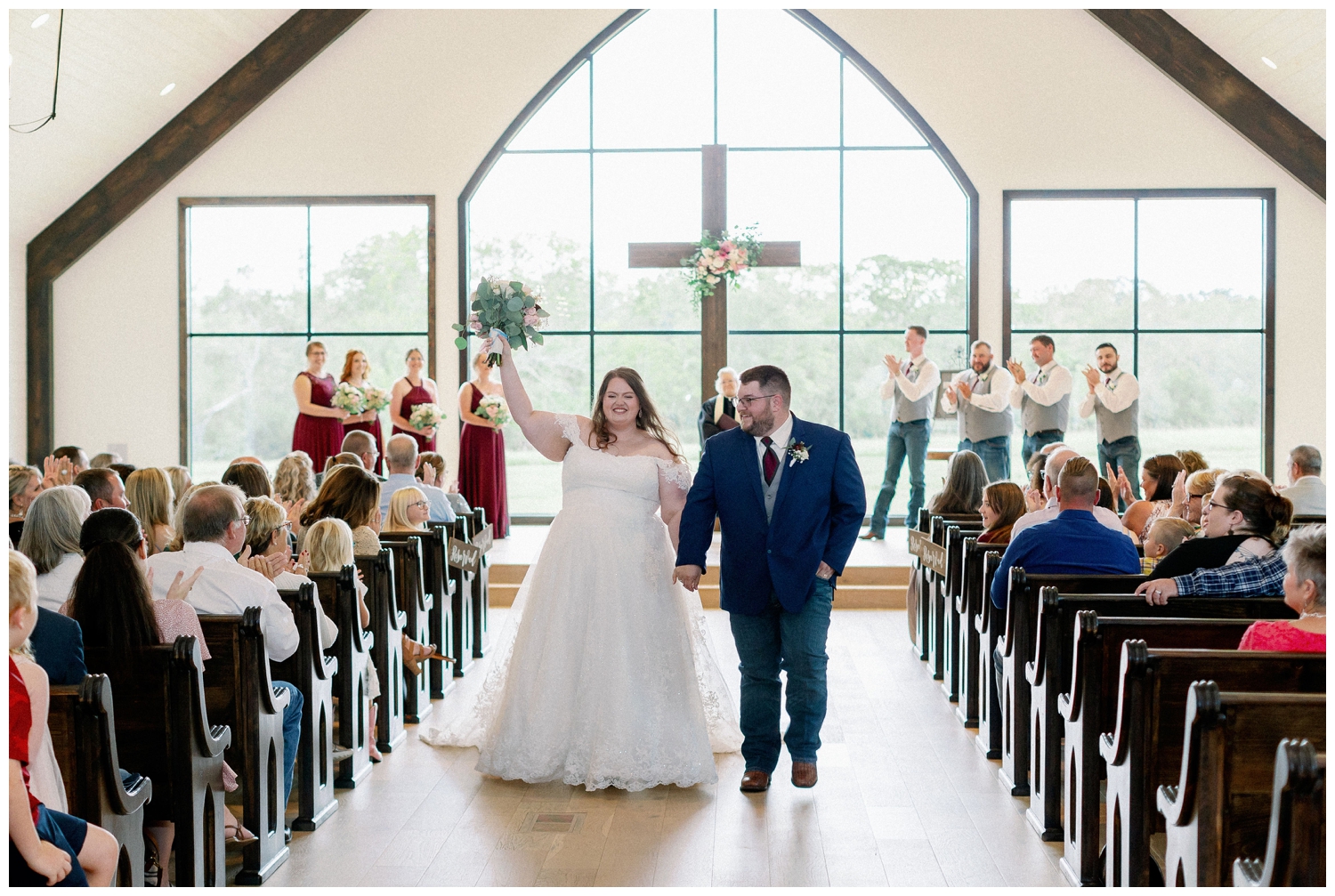 newlywed ceremony exit for College Station wedding photographer inside the chapel at Deep in the Heart Farms