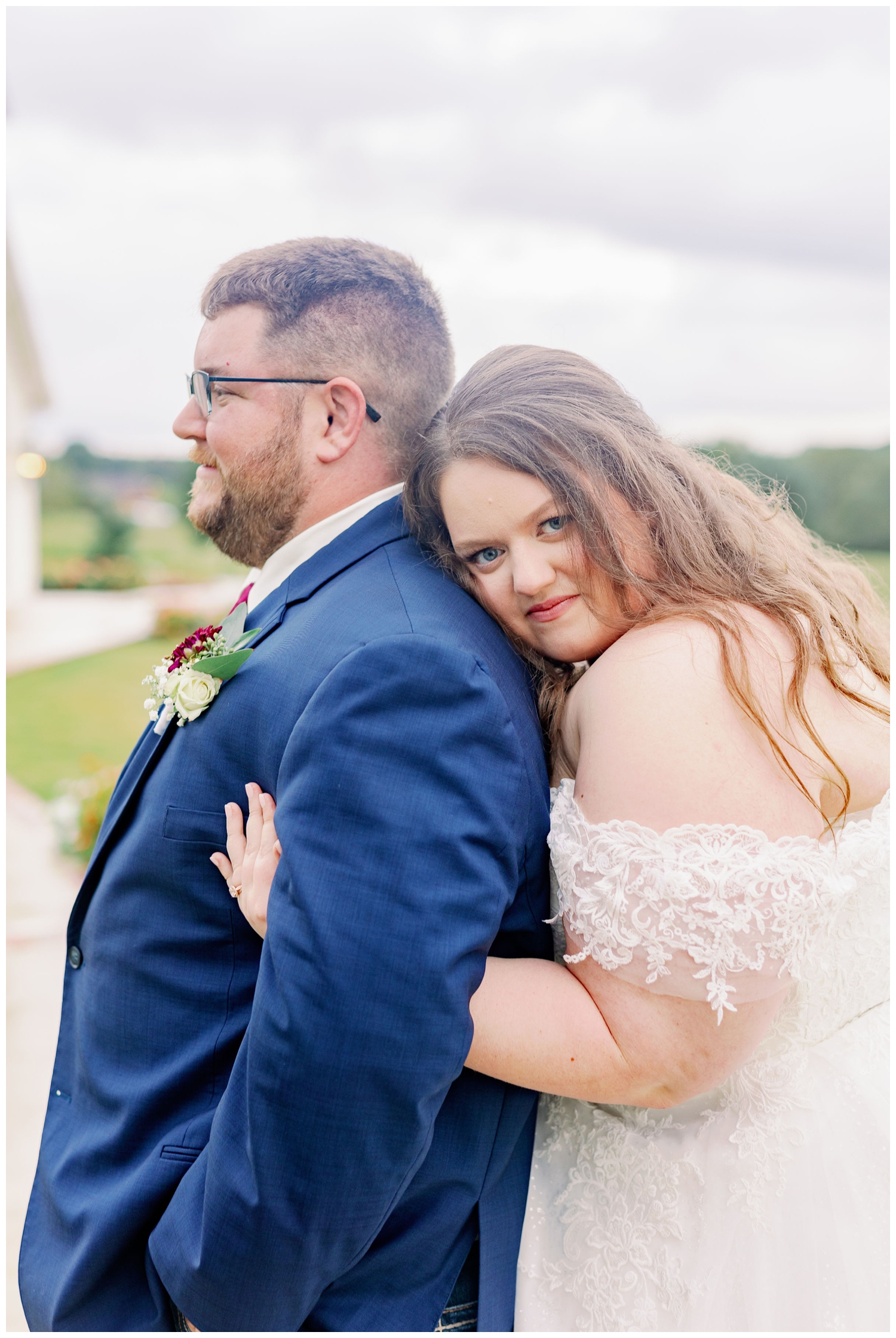 bride hugging her groom for College Station wedding photographer at Deep In The Heart Farms